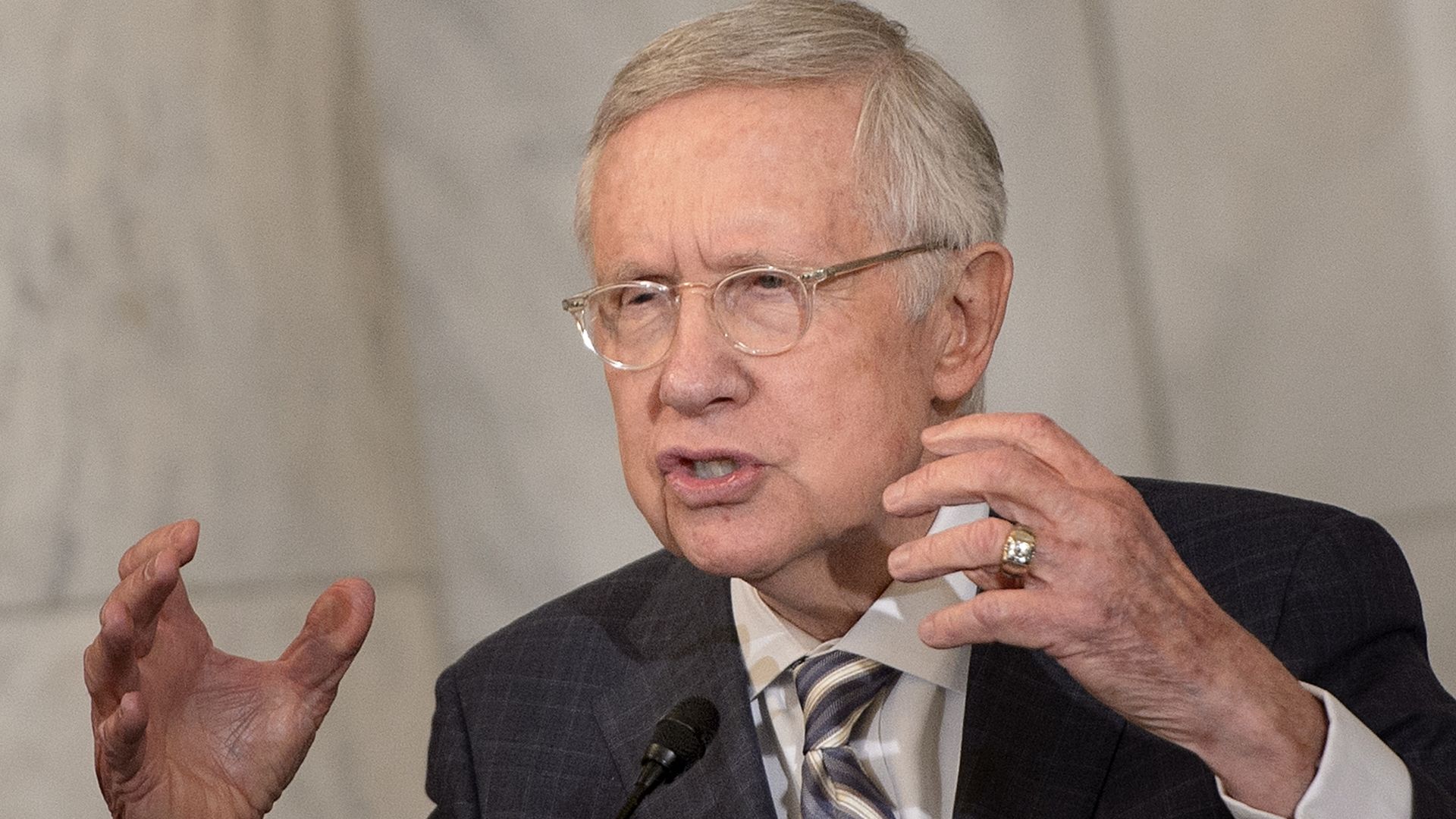 The late Sen. Harry Reid is seen gesturing as he speaks.