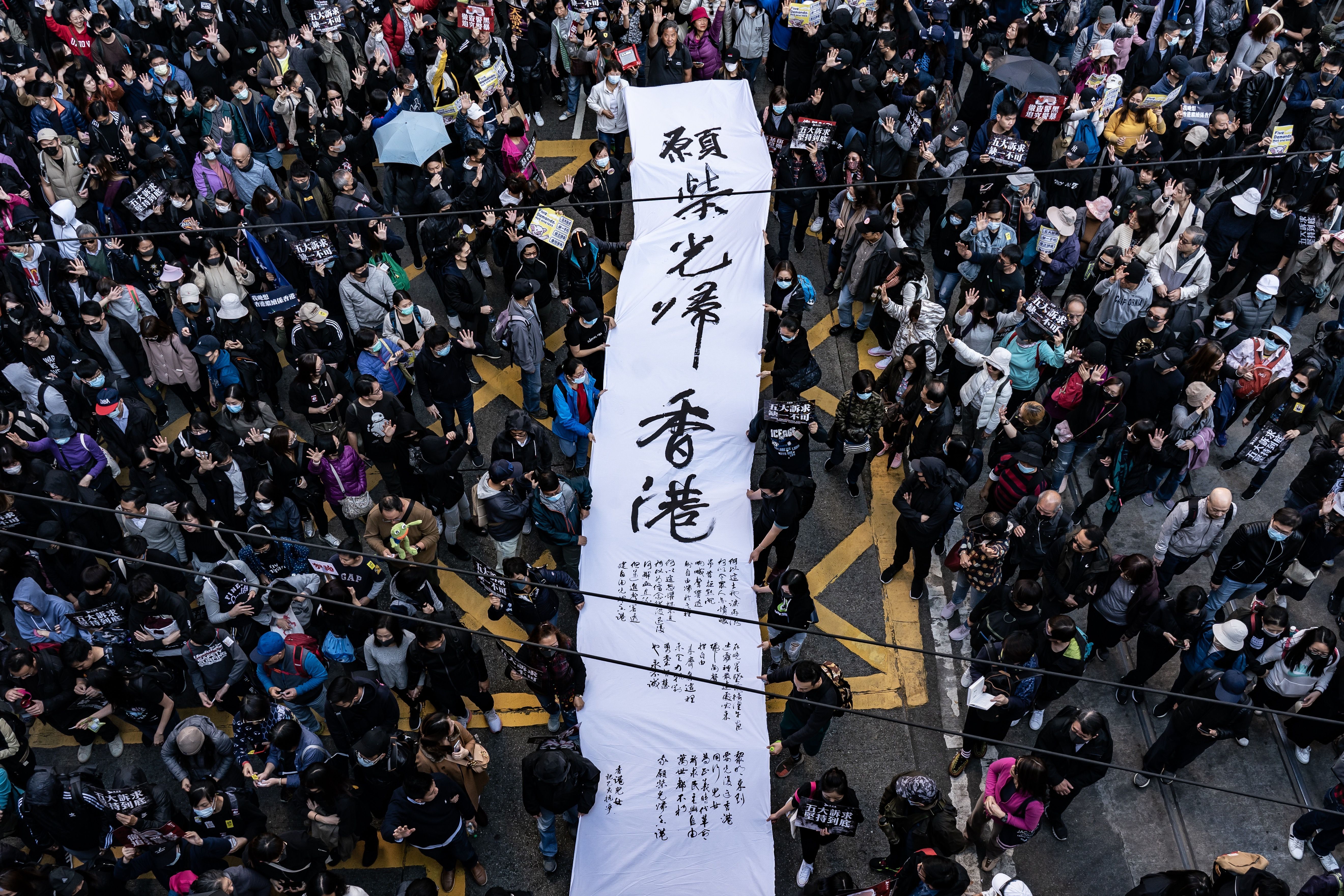 Demonstrators holding a banner