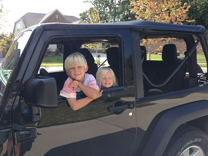 kids in a jeep