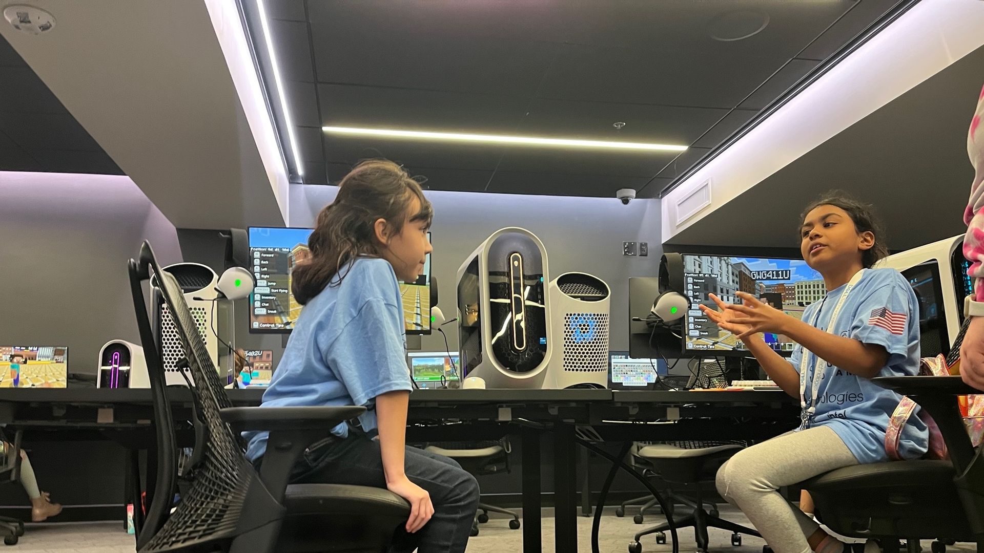 Young women talk about gaming strategy.