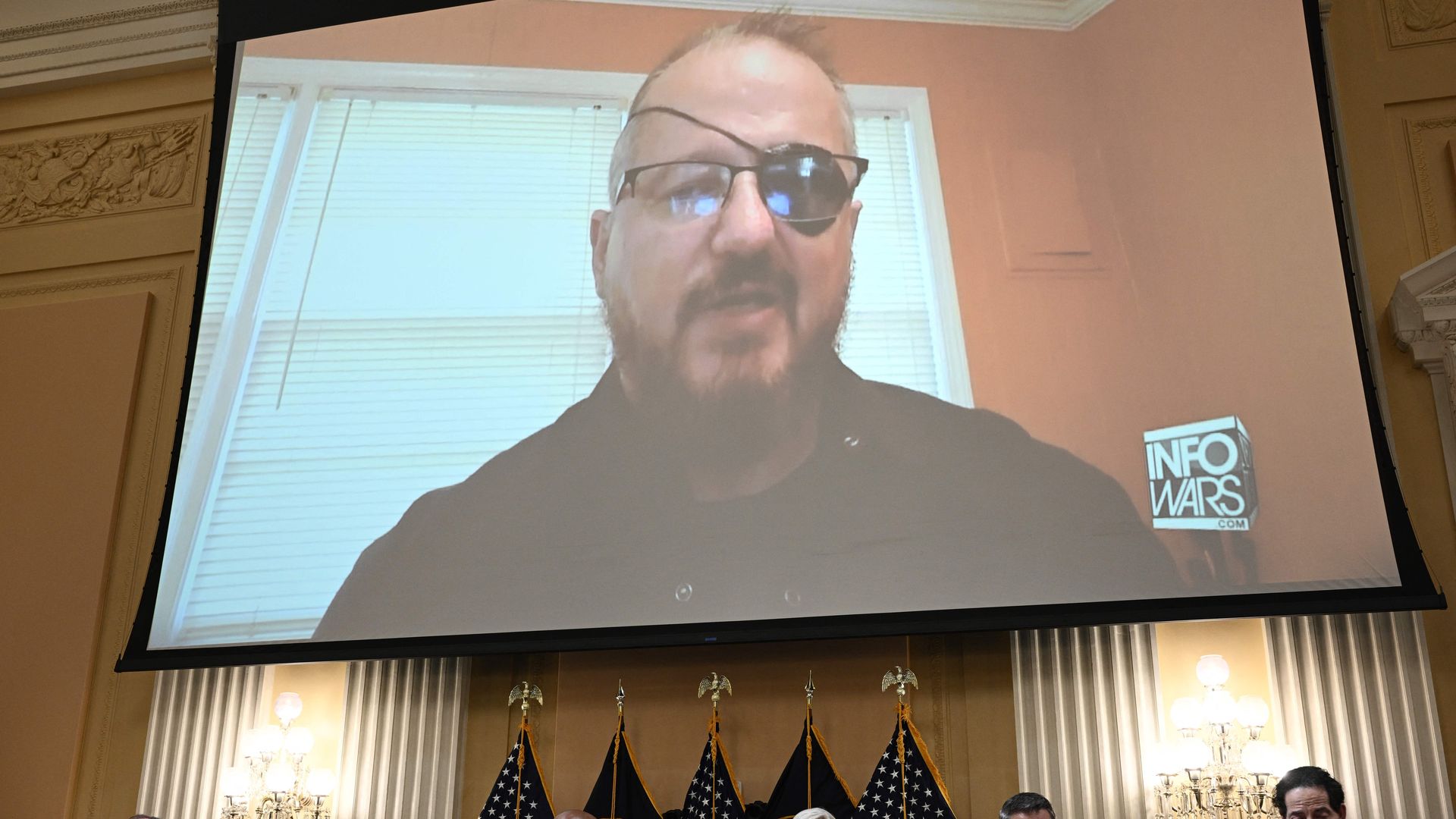 Stewart Rhodes, founder of the Oath Keepers, is seen on a screen.