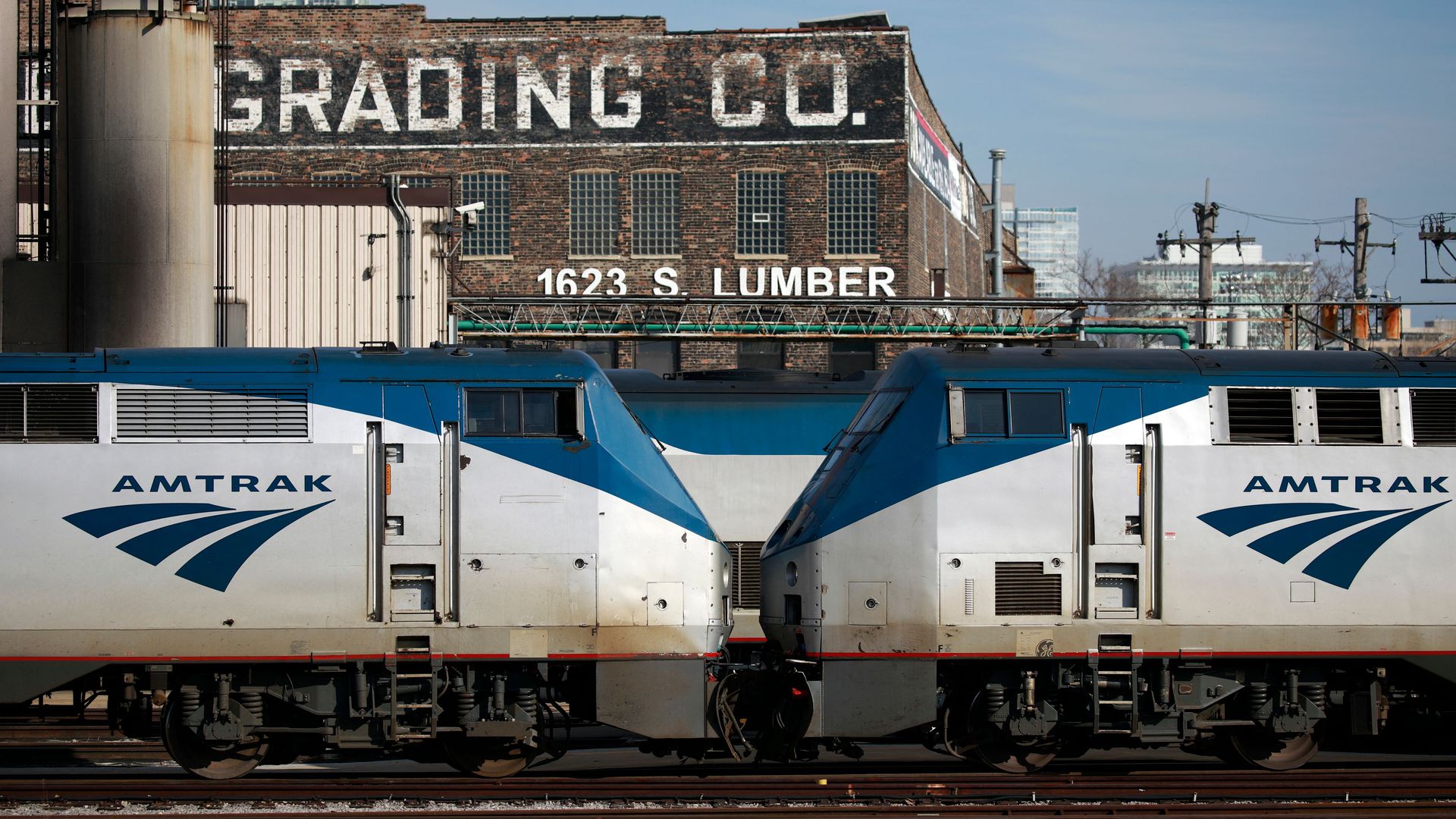 Amtrak passenger railroad locomotives sit parked in a rail yard at Chicago Union Station in Chicago, Illinois, on March 2, 2022