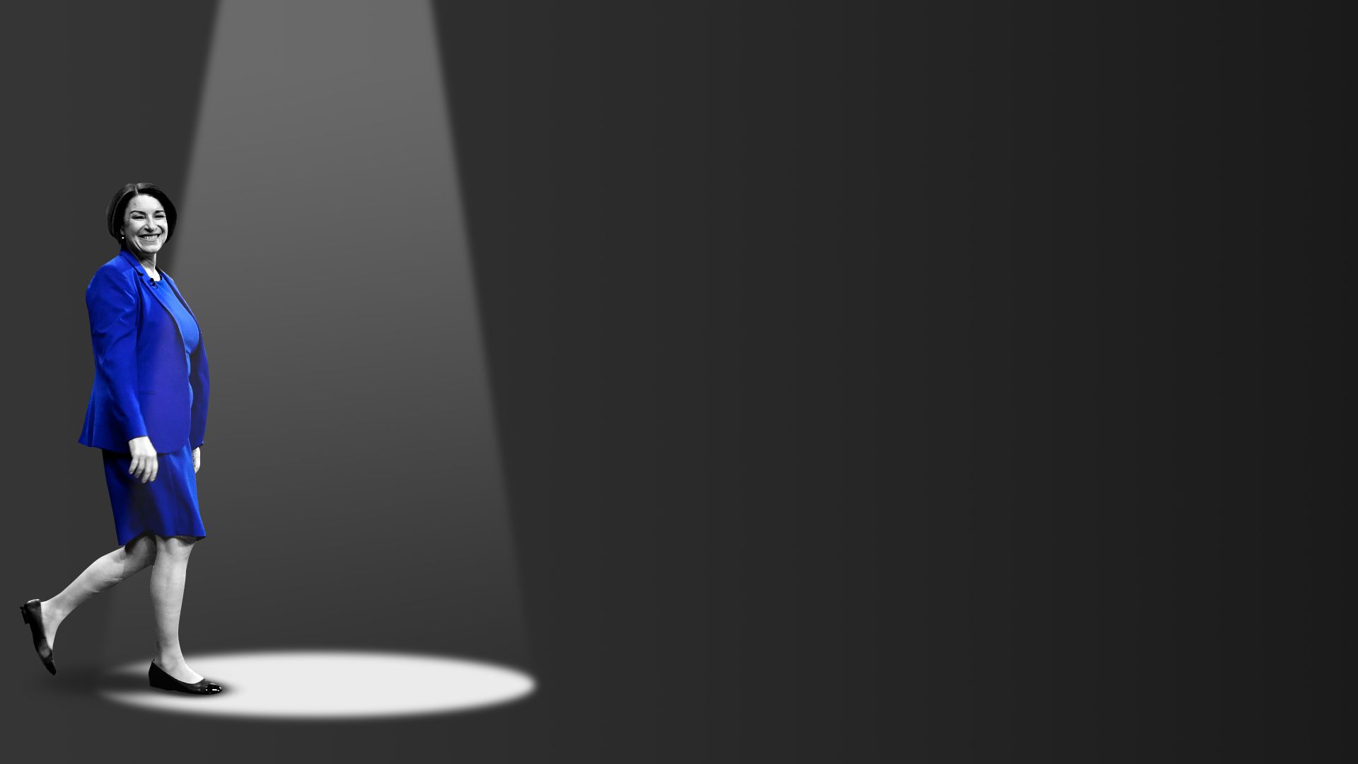 Photo illustration of Amy Klobuchar walking into a spotlight.