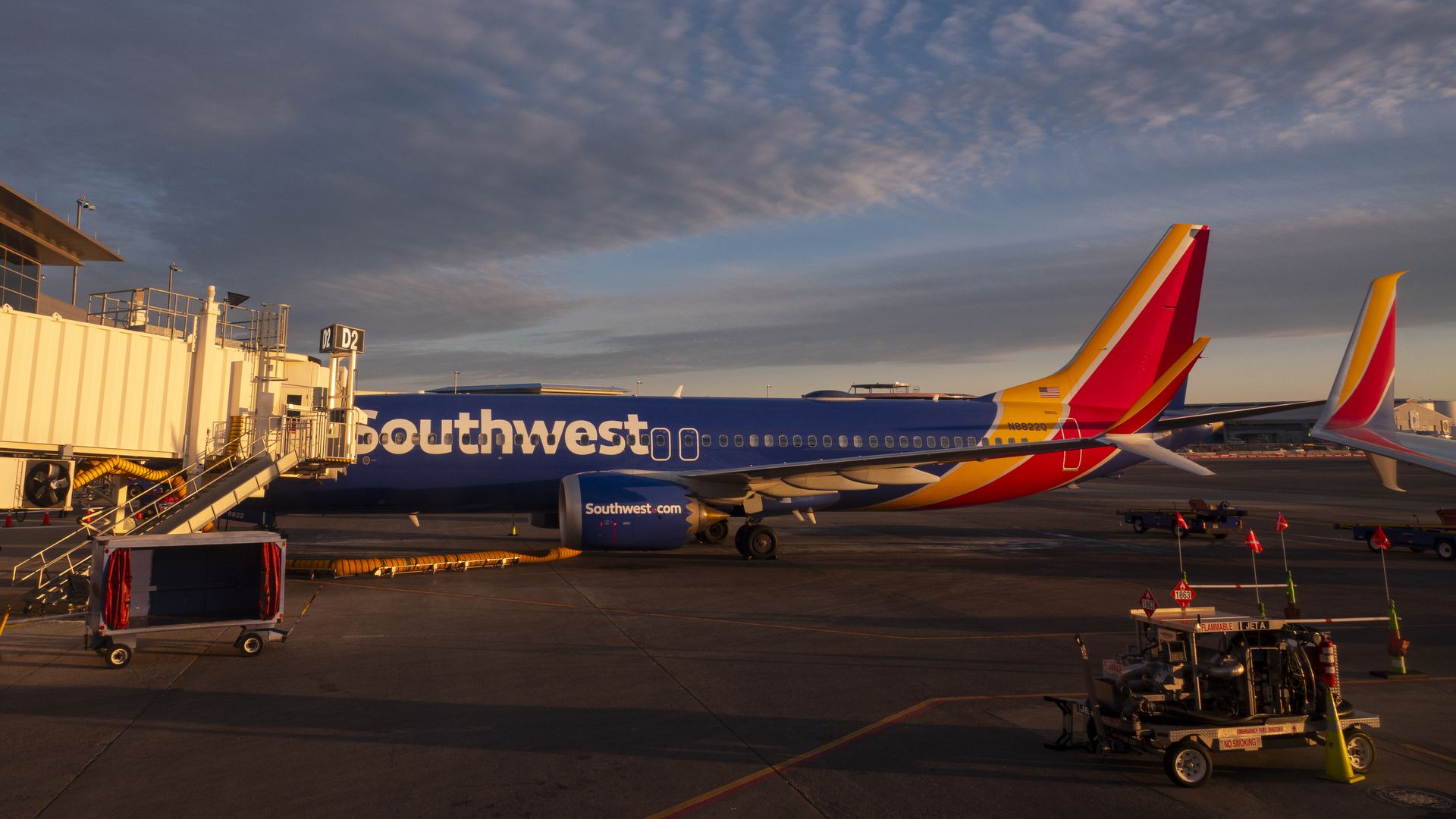 A Southwest Airlines Boeing MAX 8 aircraft is parked at a jetway at sunset at Nashville International Airport on January 22, 2025 in Nashville, Tennessee.