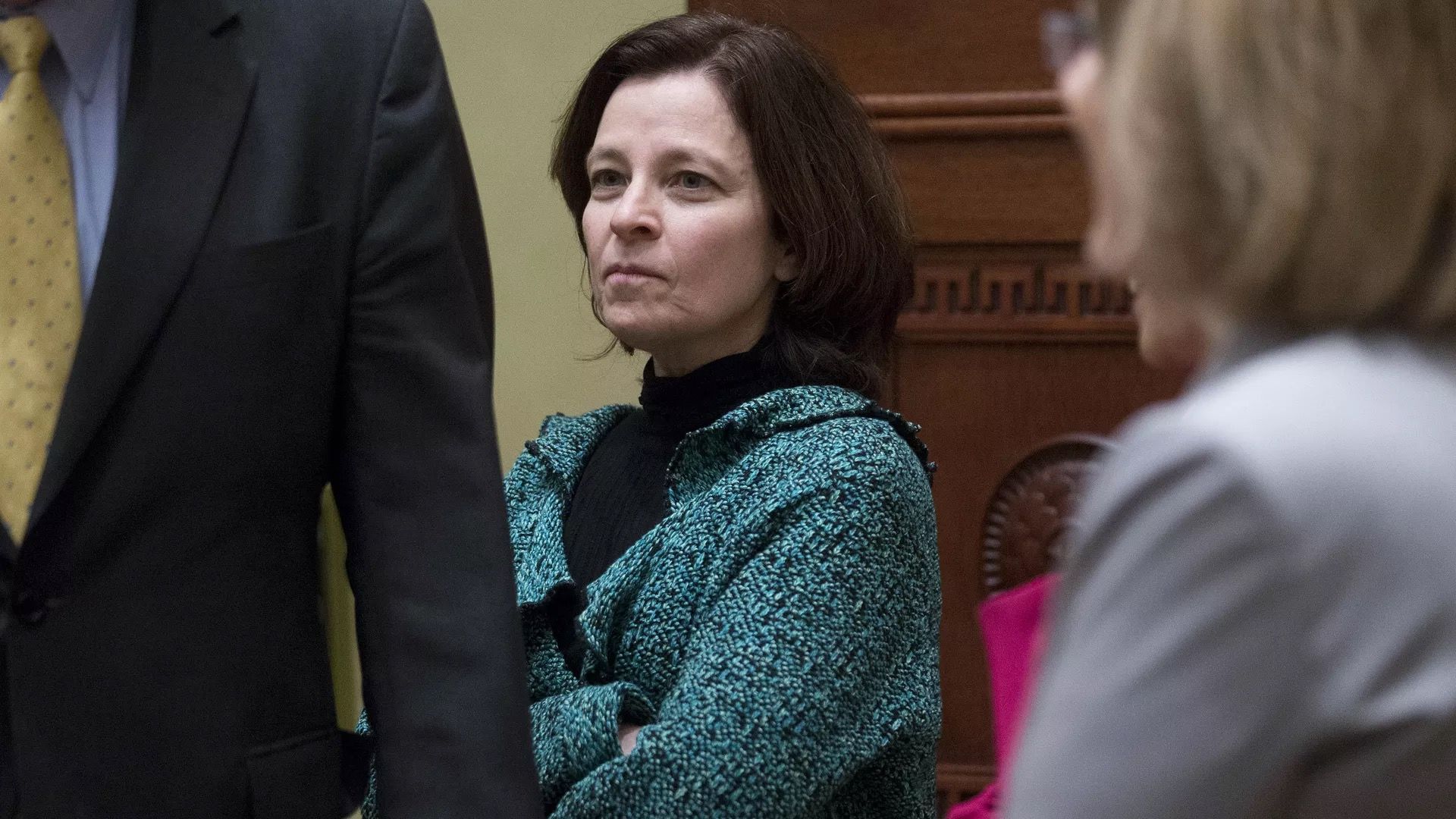 Federal Reserve nominee Sarah Bloom Raskin is seen standing at a hearing.