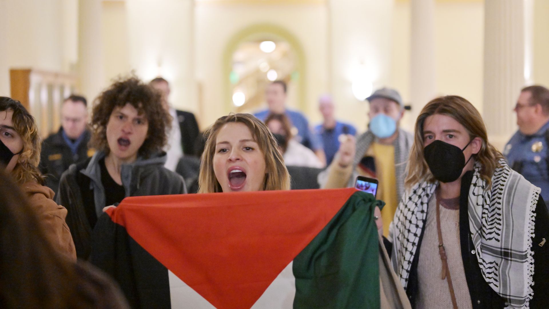 Pro-Palestine protesters are escorted out of the State Capitol during the first day of the Colorado General Assembly's 2024 session Jan. 10. Photo: RJ Sangosti/Denver Post via Getty Images