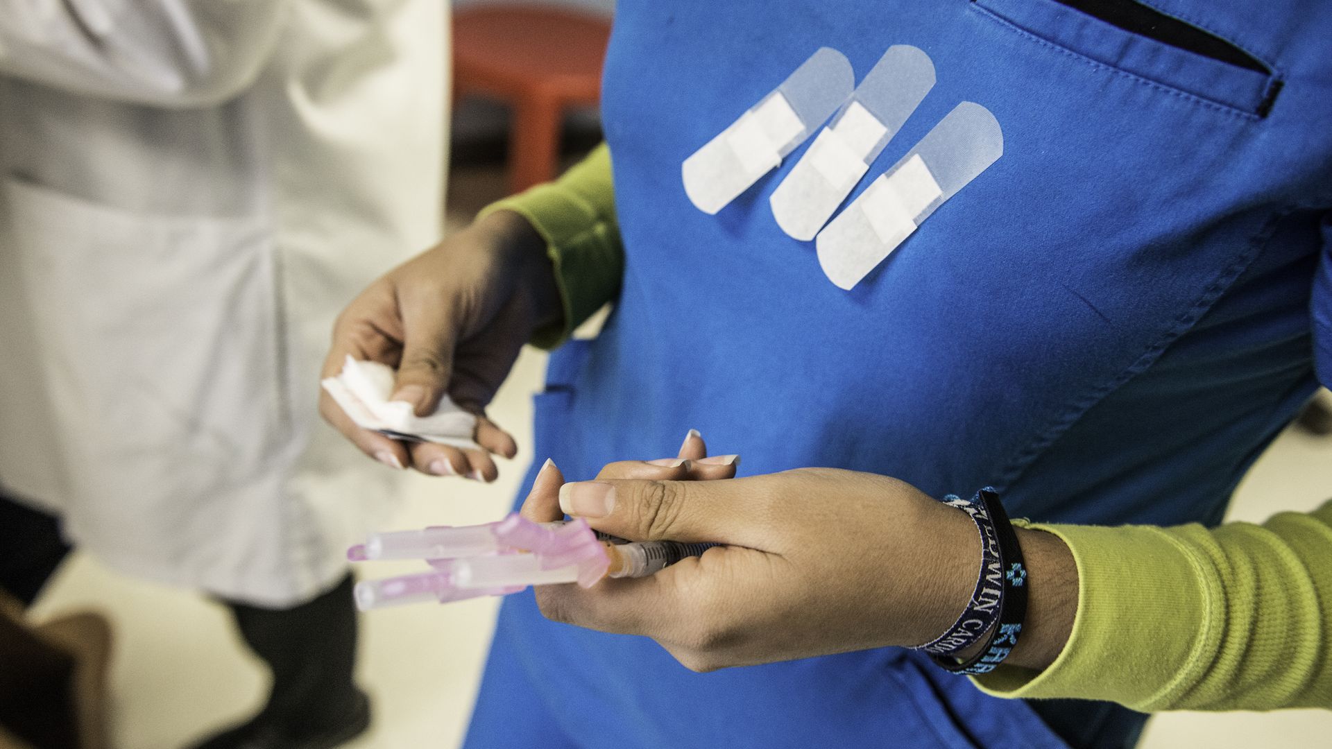 Certified medical assistant Karla Huerta holds needles full of the HPV vaccination drug Gardasil before administering them to children at Amistad Community Health Center in Corpus Christi, Texas on Friday May 27, 2016.