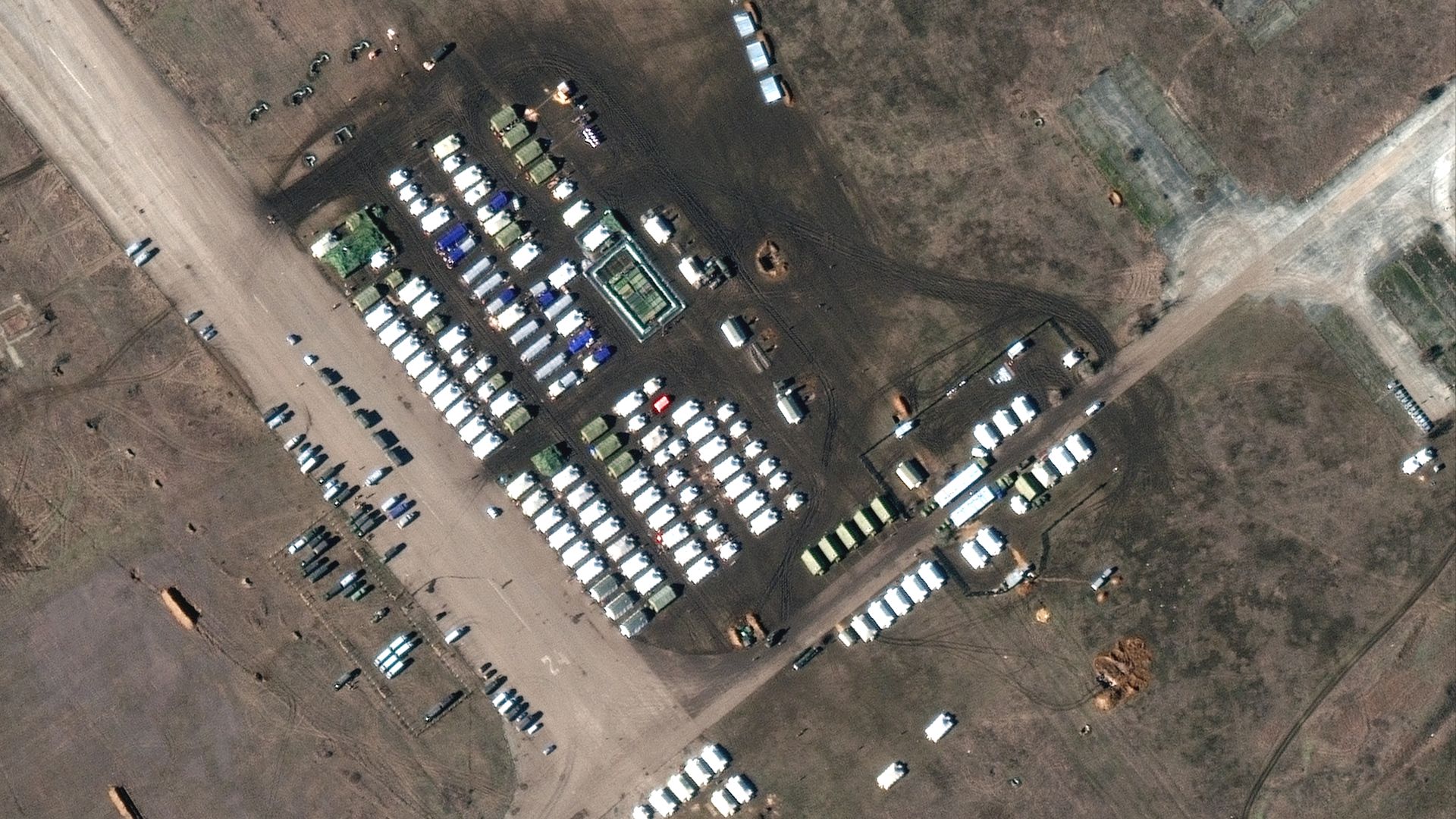 A satellite image of new troops and military equipment, including tents, deployed near an airfield in Crimea captured on Feb. 10.