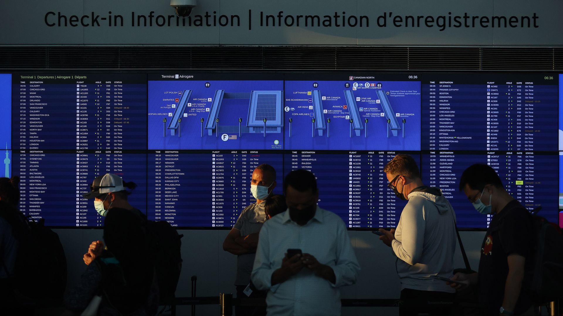 People waiting for flights in the Toronto Pearson International Airport in July 2022.