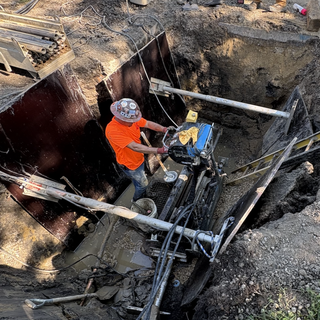Why does Elgin pay a third of Chicago's costs to remove lead service lines?
