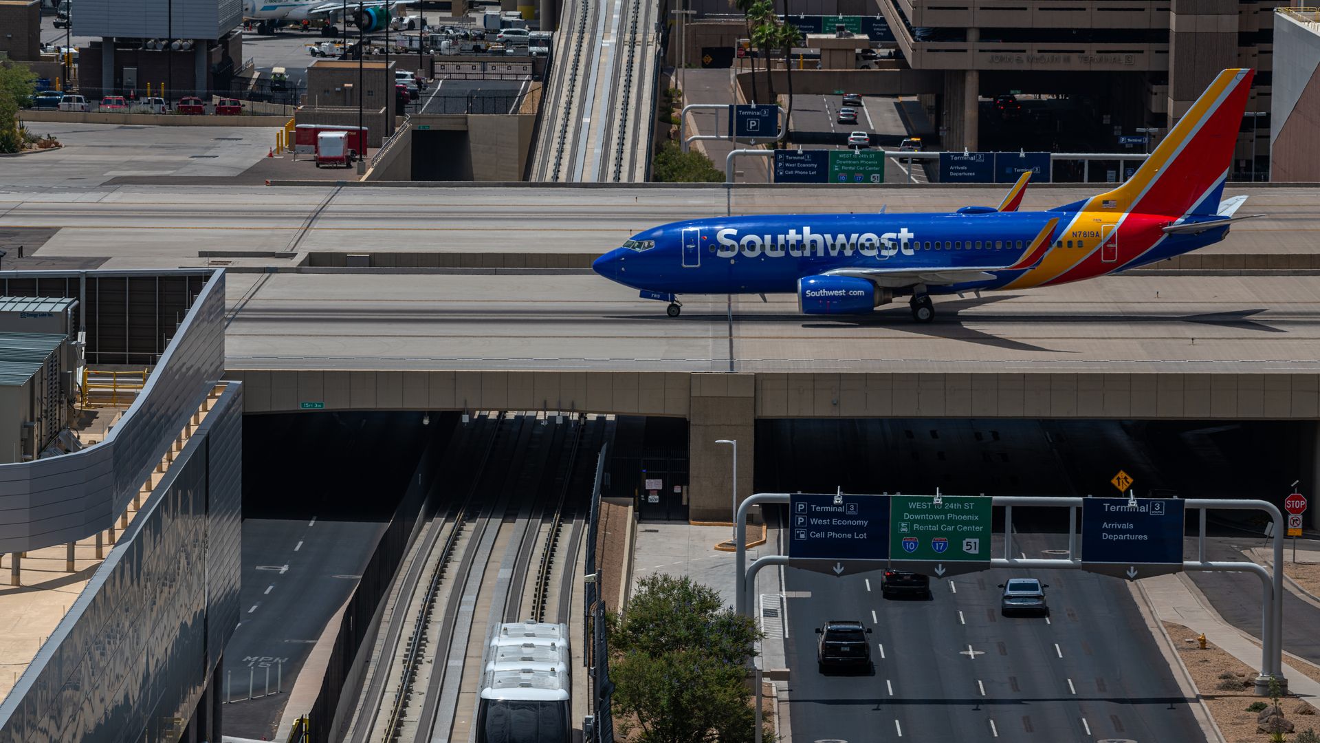 A plane taxiing at an airport. 