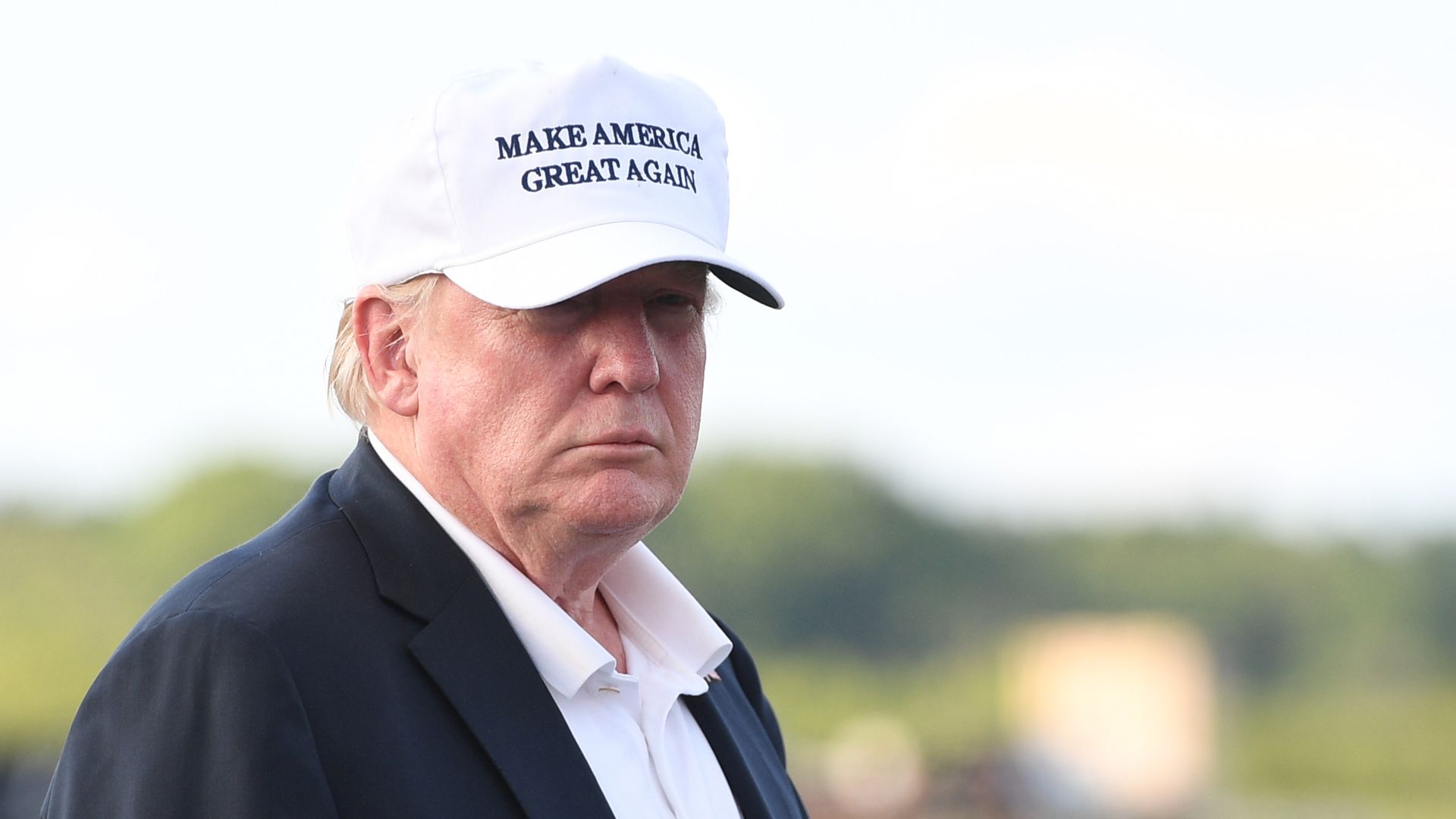 Trump wearing MAGA hat.