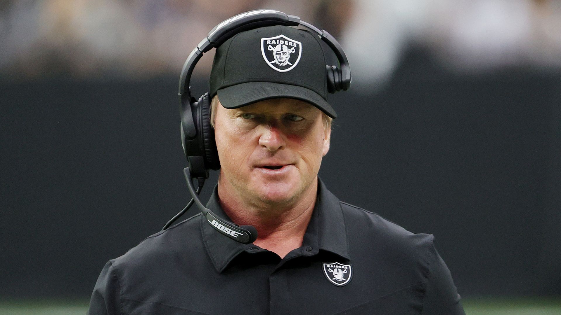 Former Las Vegas Raiders head coach John Gruden during a game against the Chicago Bears at Allegiant Stadium on October 10, 2021 in Las Vegas, Nevada. 