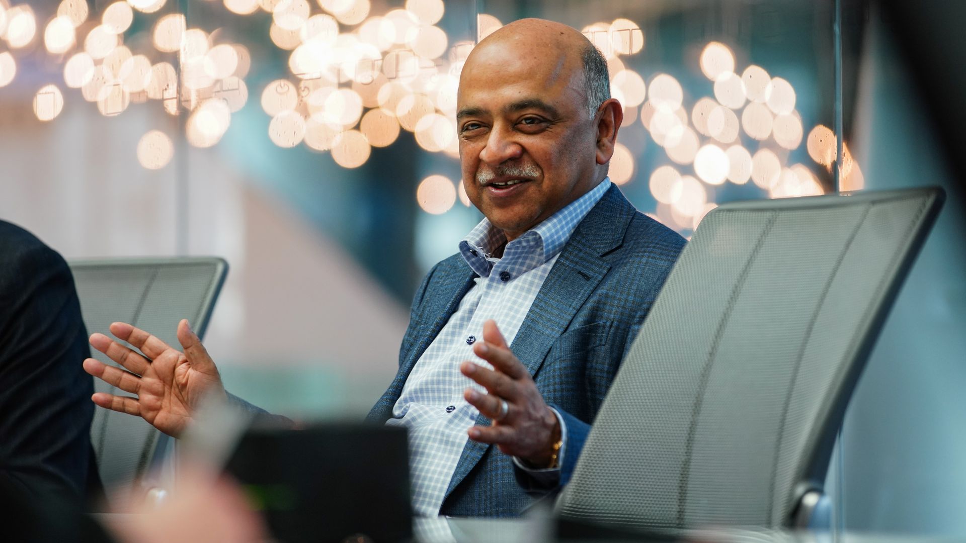 Photo of Arvind Krishna smiling, hands gesturing