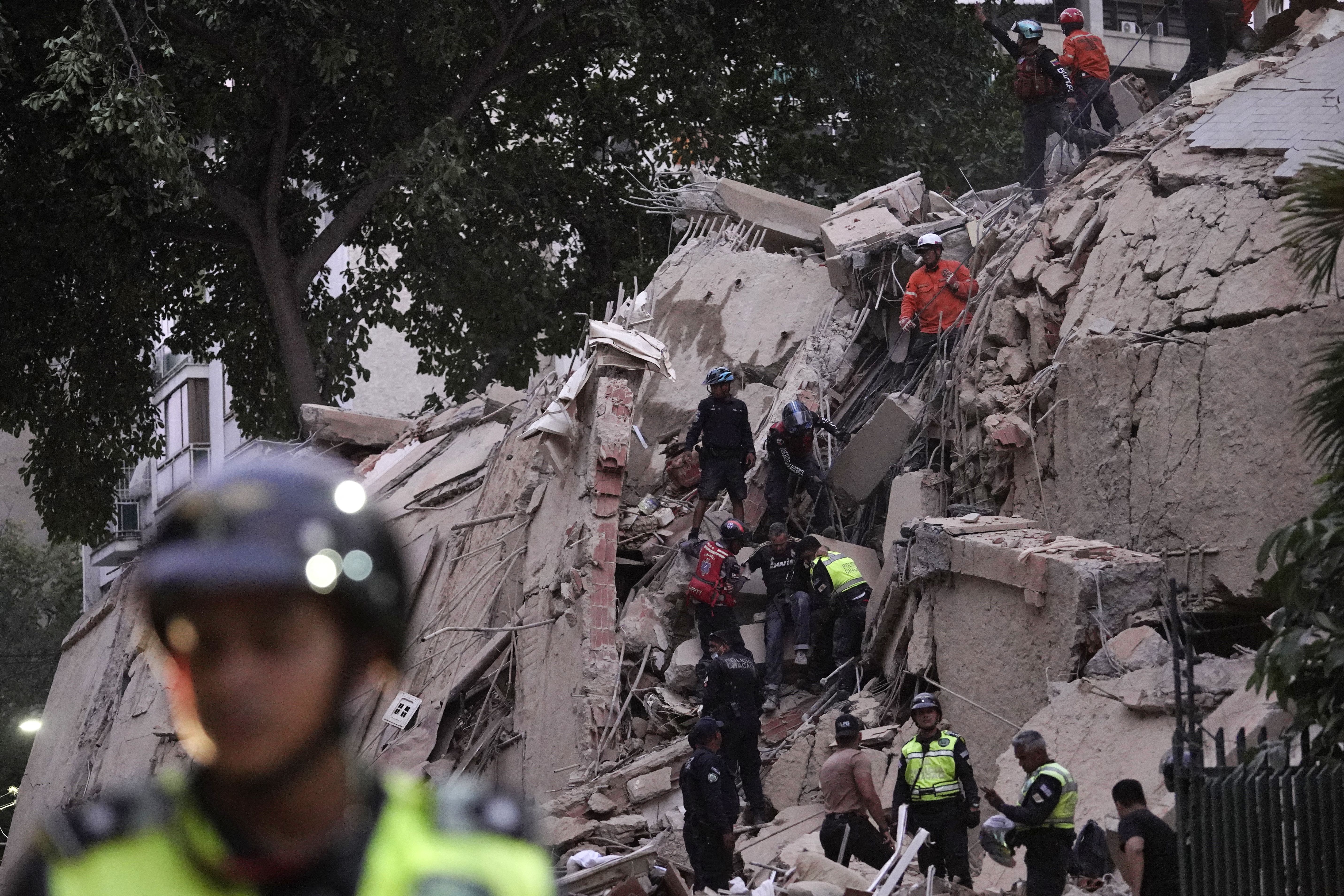 Rescuers evacuate an injured person from a collapsed building in Caracas, Venezuela, after major earthquakes last night. Photo: Manaure Quintero/AFP via Getty Images
