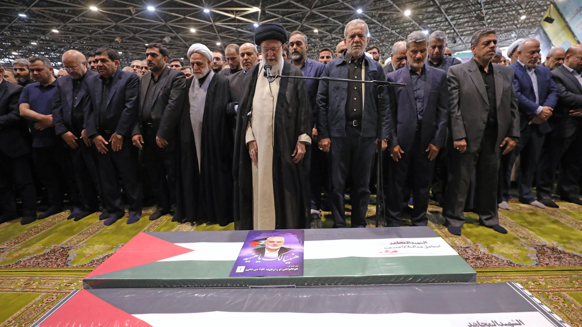 Iranian Supreme Leader Ayatollah Ali Khamenei, center, leads a prayer over the coffins of Hamas leader Ismail Haniyeh and his bodyguard during their funeral ceremony in Tehran on Aug. 1, 2024