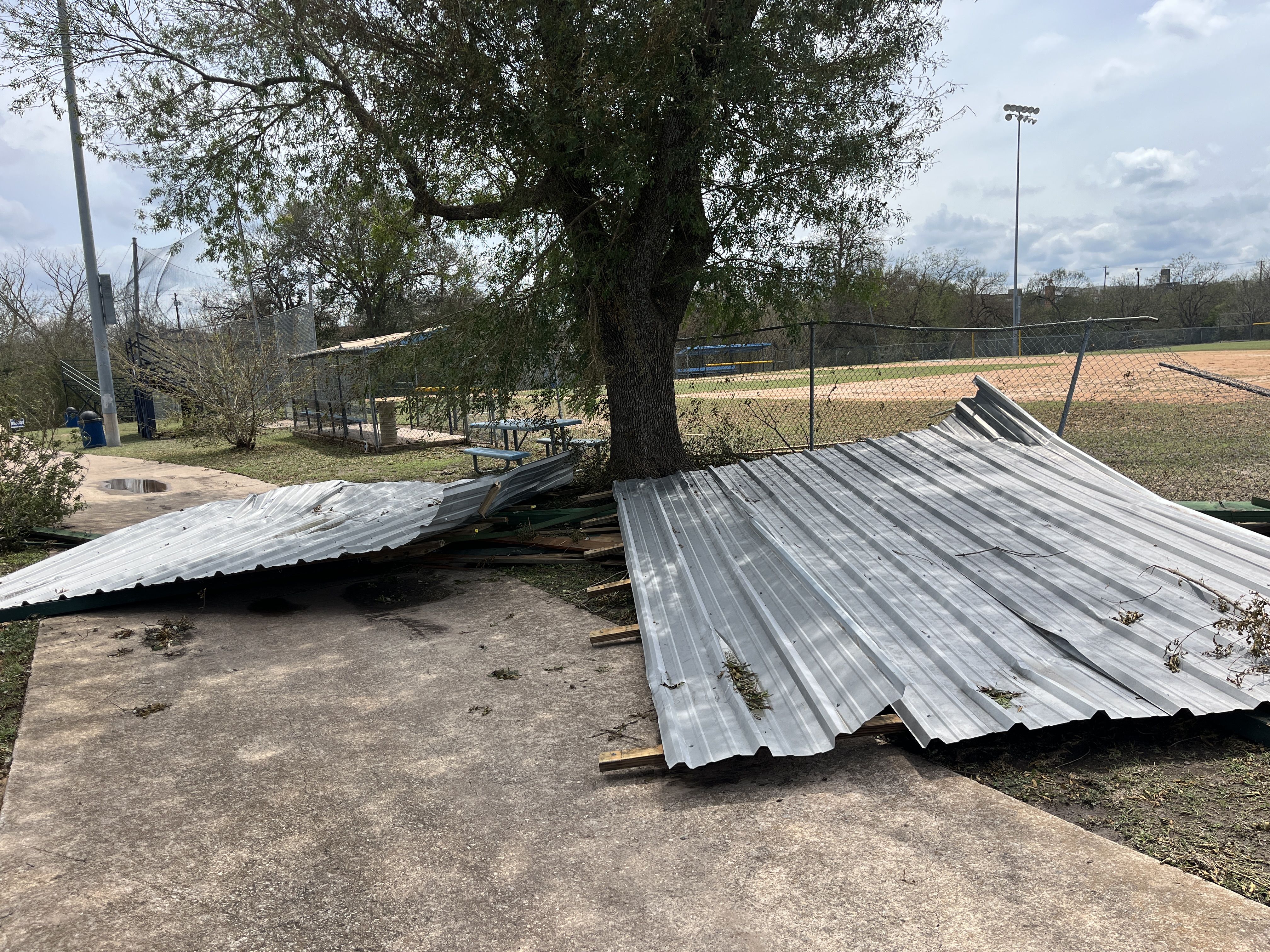 A photo of downed metal at a baseball field