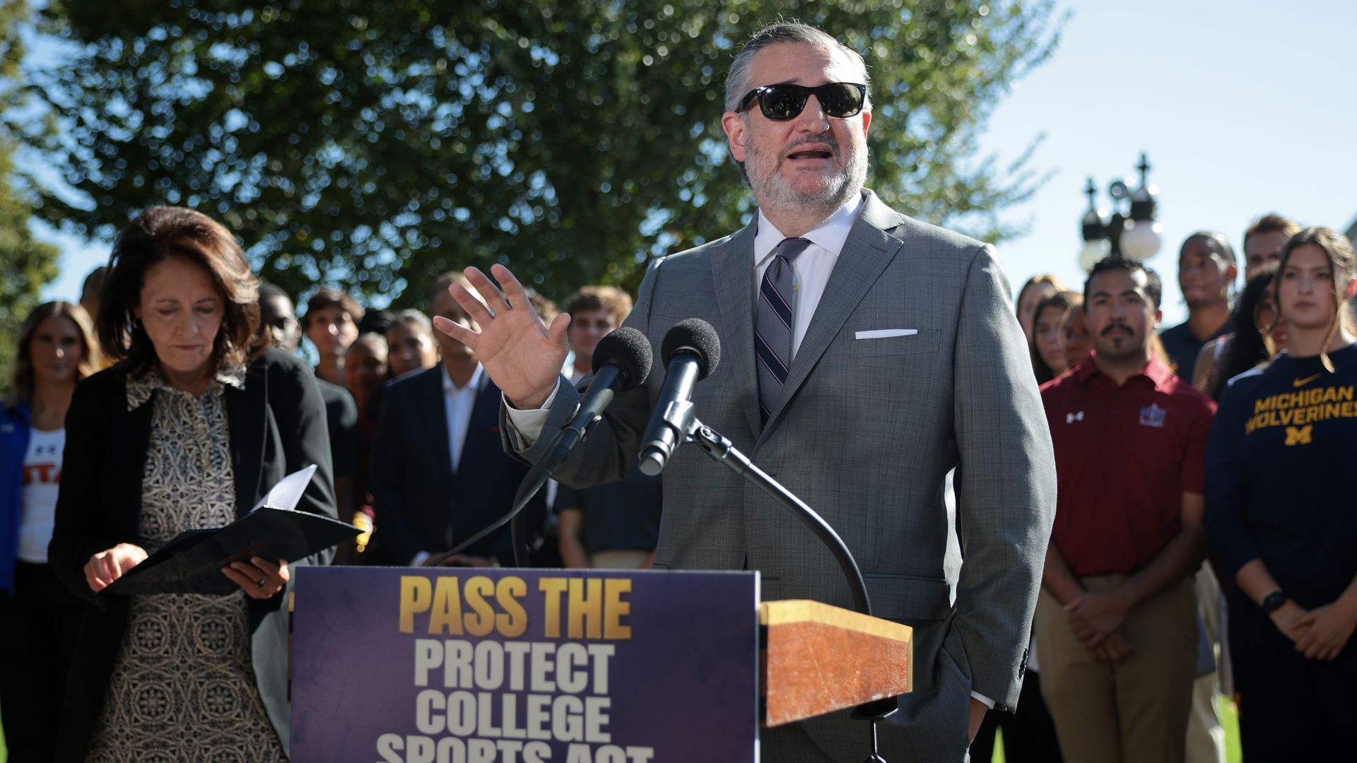 U.S. Senate Committee on Commerce, Science & Transportation Chairman Ted Cruz (R-TX) (C) and ranking member Sen. Maria Cantwell (D-WA) (L) hold a news conference with NCAA athletes and coaches about the Protect College Sports Act