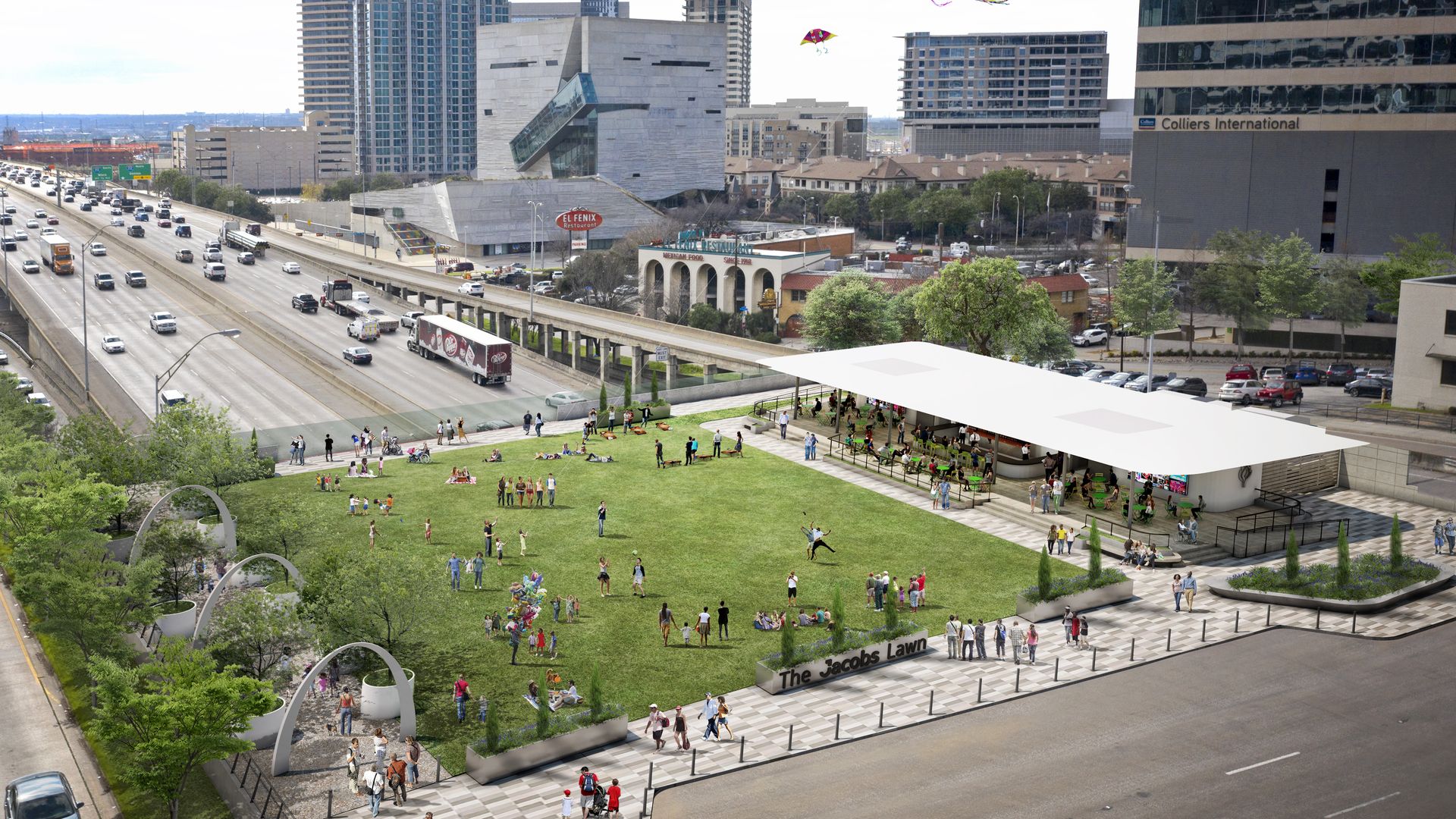 Wide cityscape with a busy freeway on the left, modern glass towers, a green lawn in the foreground labeled "The Jacobs Lawn", people enjoying the park, and colorful kites in the sky.