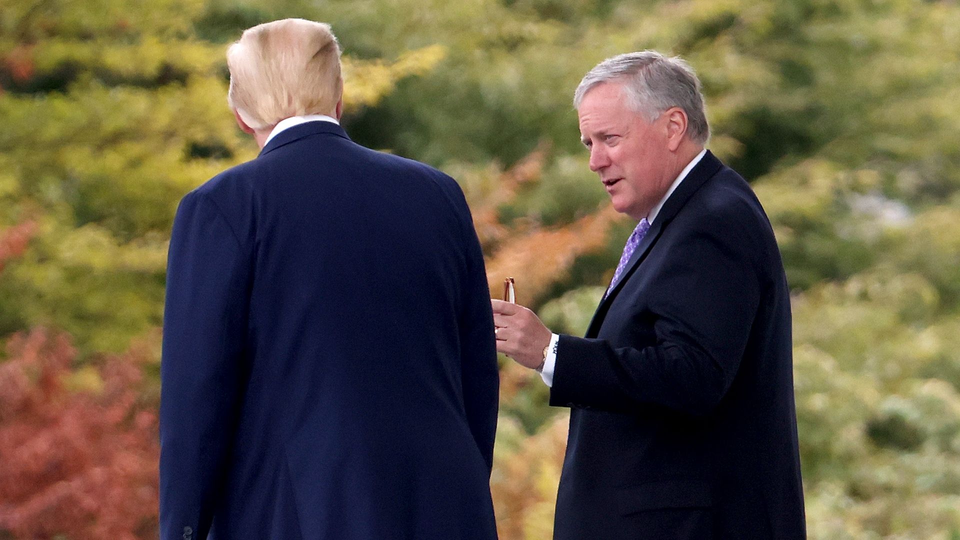 President Donald Trump confers with White House Chief of Staff Mark Meadows while departing the White House September 1, 2020 in Washington, DC. 
