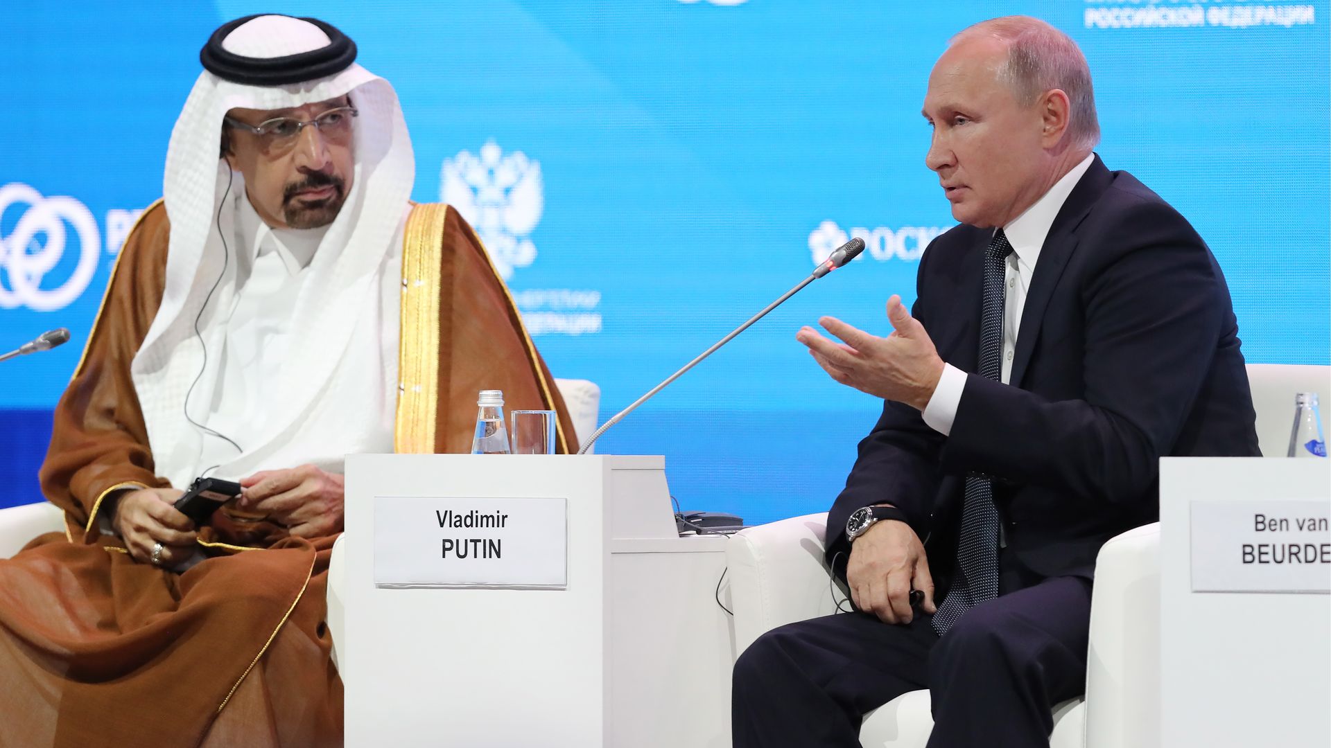 Khalid A. Al-Falih and Vladimir Putin seated onstage at a conference