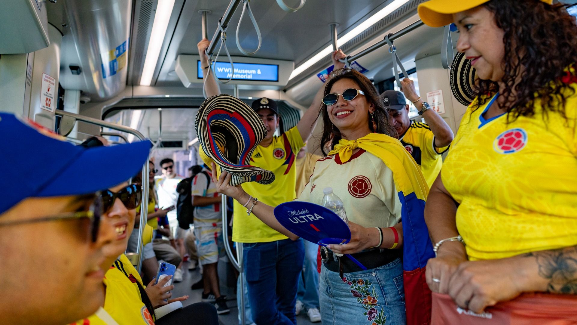 Colombian fans ride on the subway to take part in a "banderazo" flag-waving gathering at Mill Creek Park in Kansas City on July 2, 2026, on the eve of the 2026 World Cup round of 32 football match between Colombia and Ghana. 
