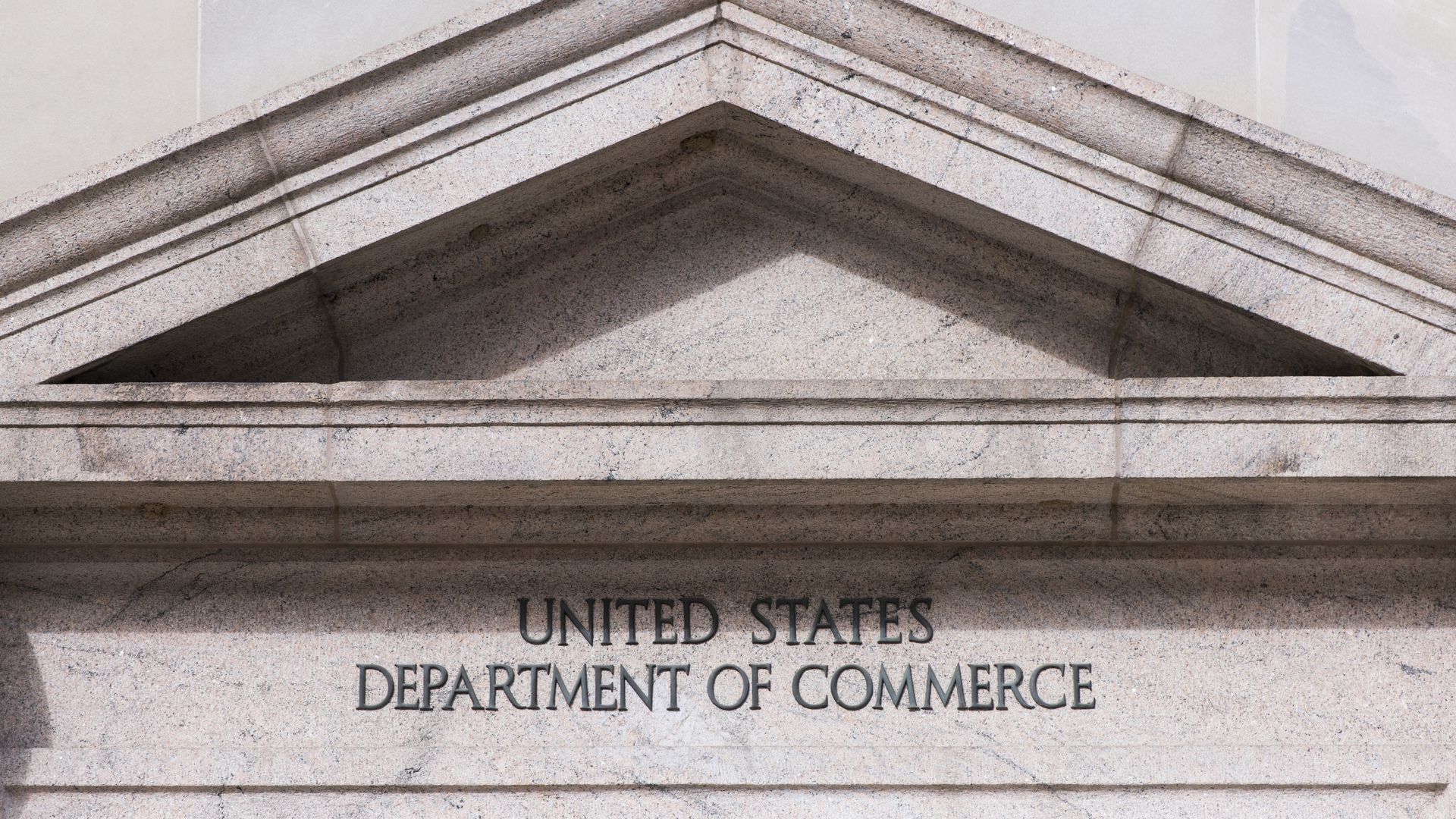 A sign on the outside of the Department of Commerce building