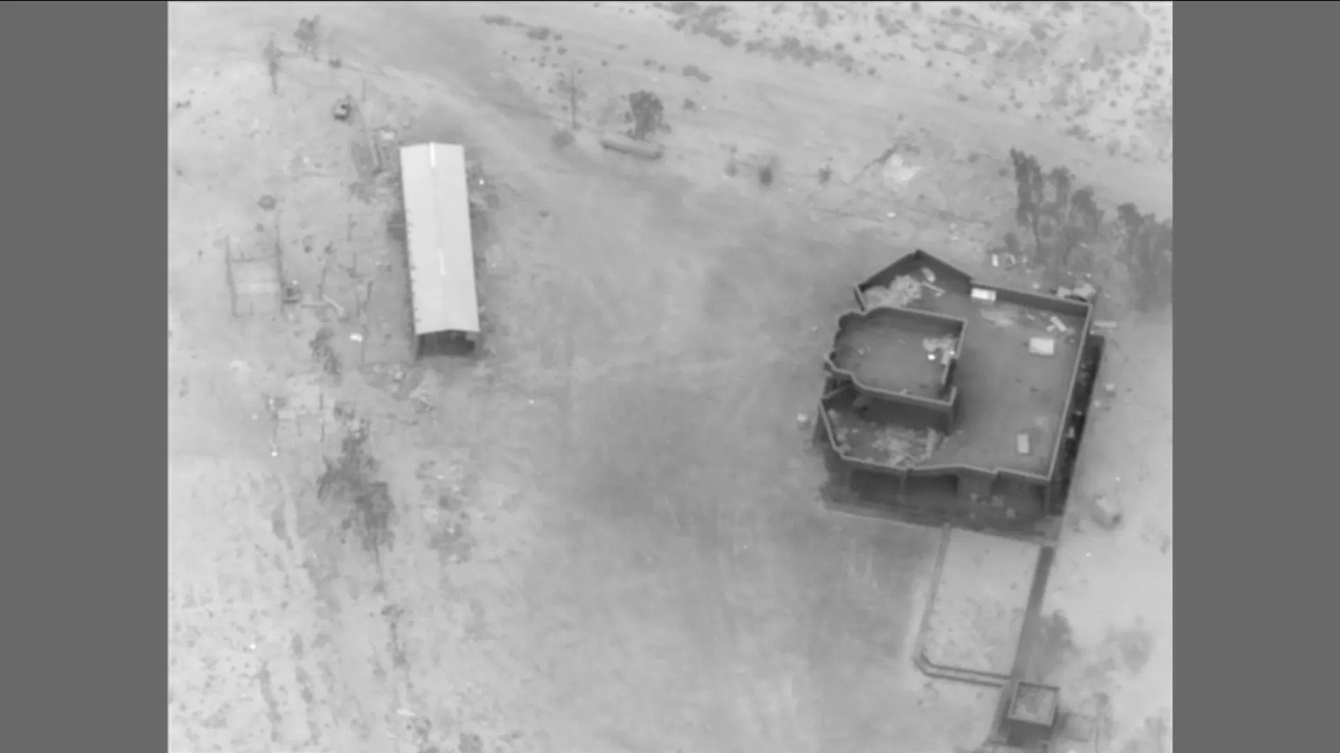 A drone image shows an Iranian militia site struck by the U.S. military along the Iraq-Syria border.