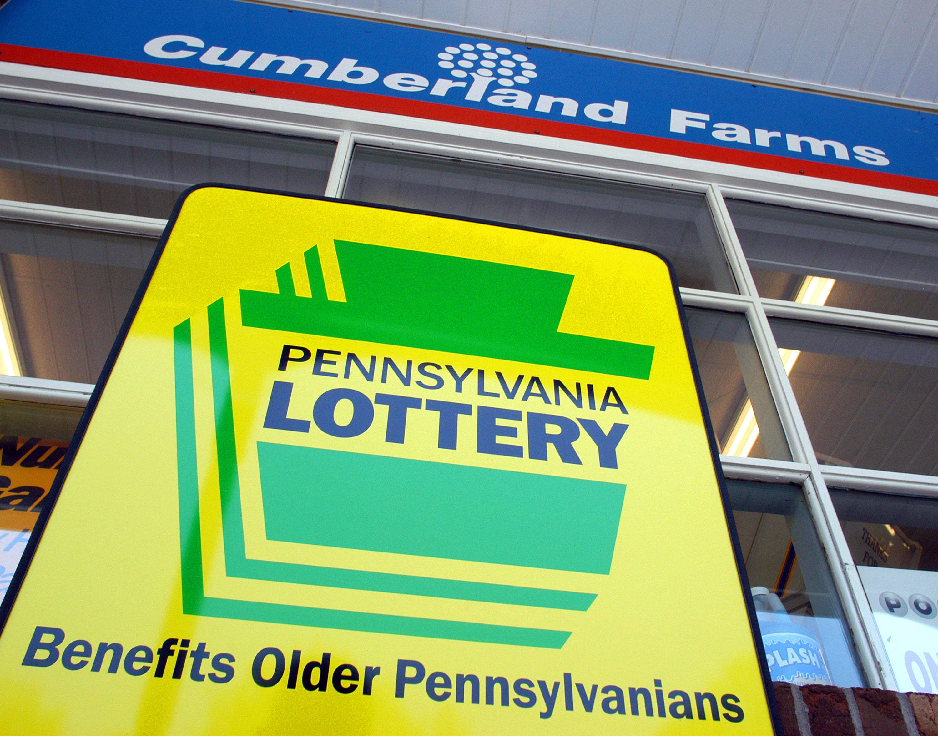 A Pennsylvania Lottery sign that says, "Benefits older Pennsylvanians," outside a Cumberland Farms convenience store .