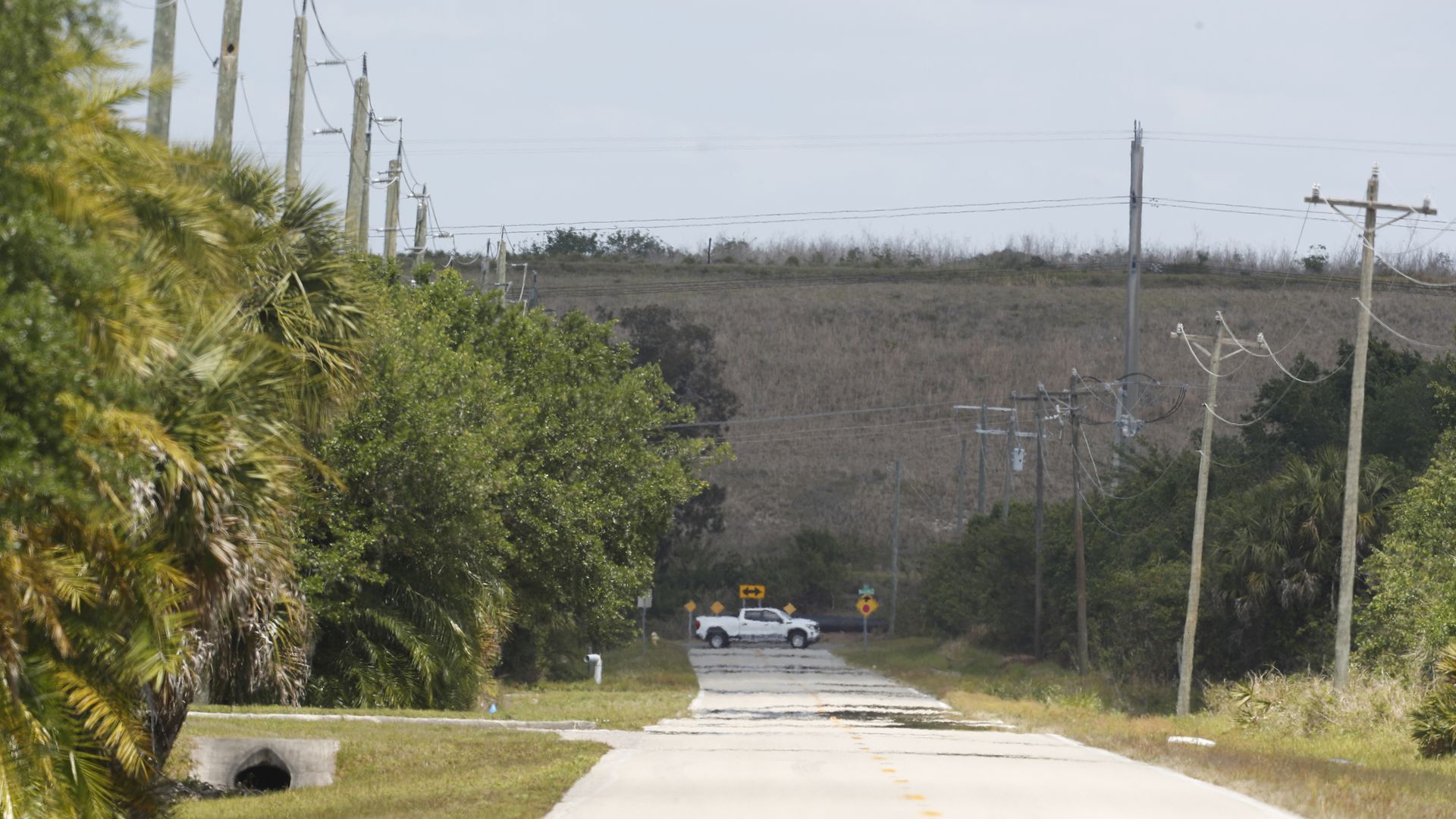 An earthen wall, side of a containment pond at the former Piney Point phosphate plant grounds, where officials earlier this year ordered residents to evacuate after a leak was discovered. 