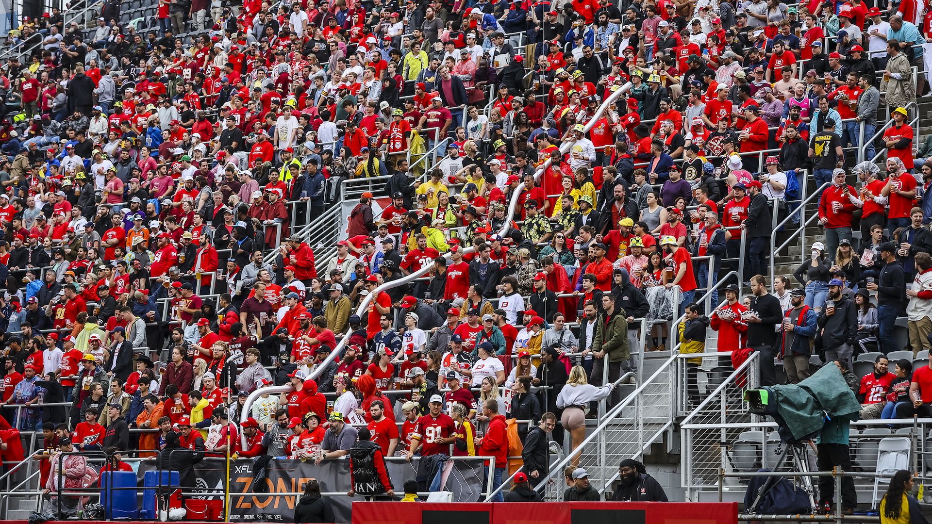 DC Defenders fans make a long "snake" out of plastic beer cups