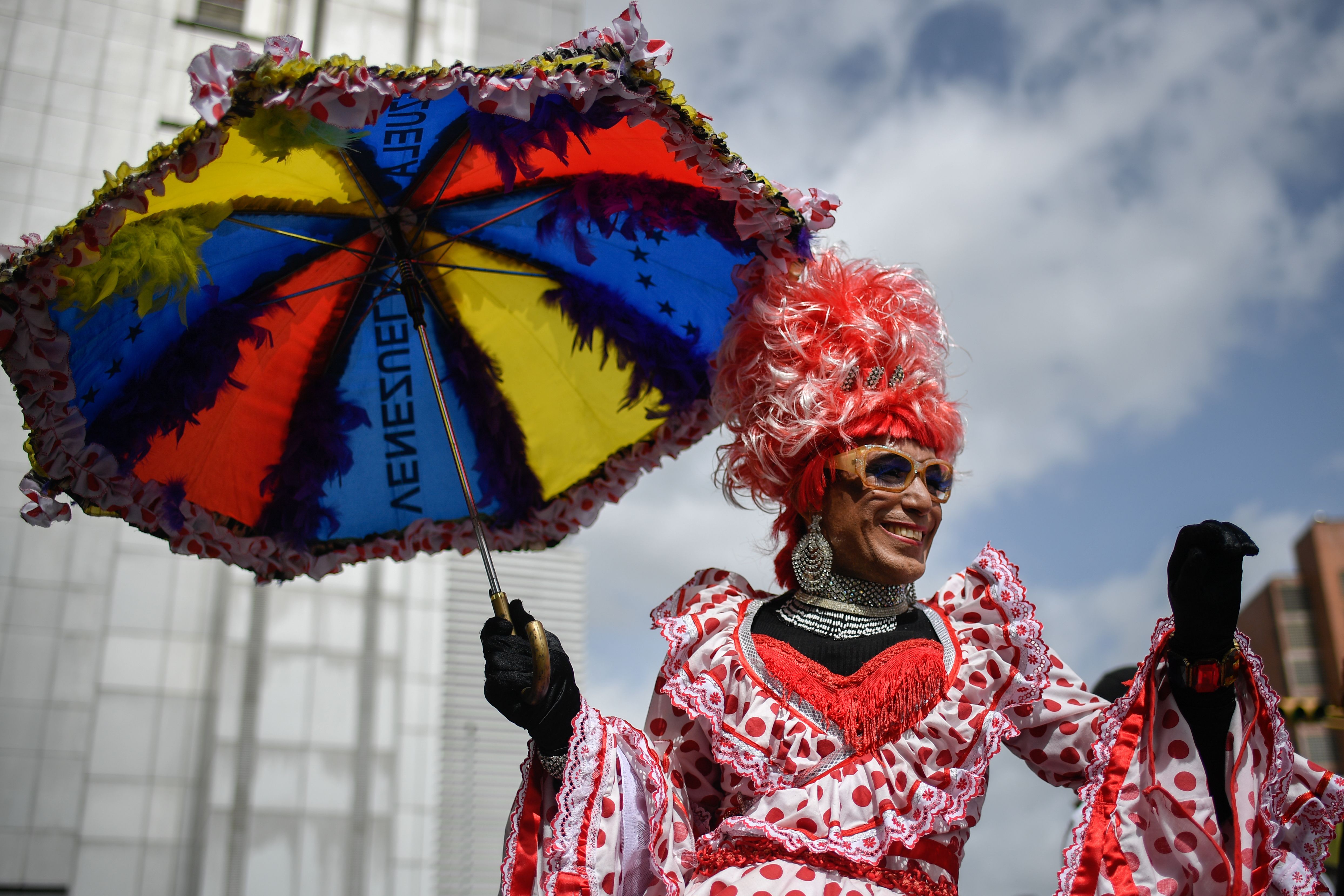  A reveler takes part in the 19th Gay Pride Parade at downtown Caracas on June 30, 2019. 