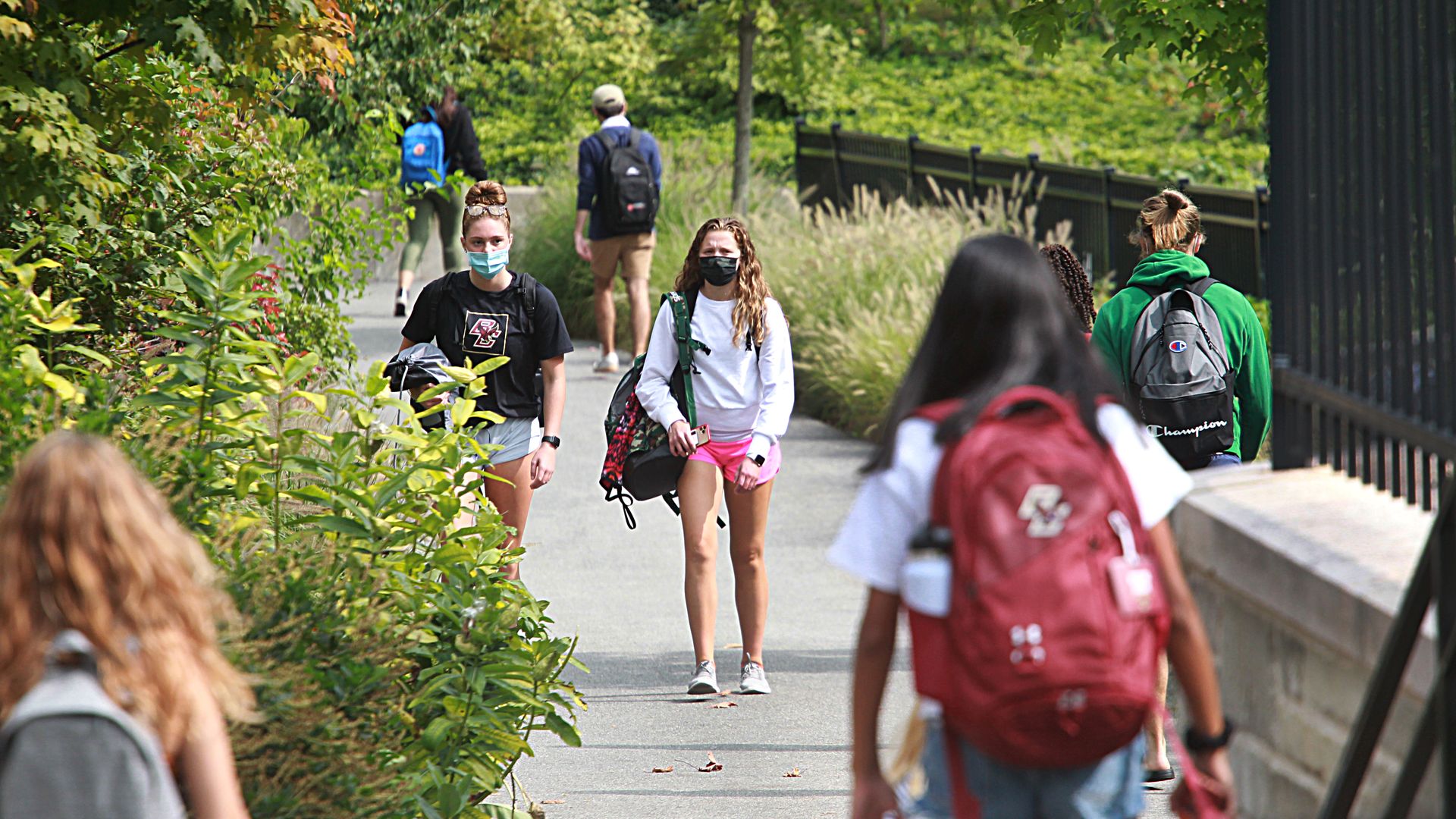 Students wearing masks walk around the Boston College Campus in Newton, Mass., on Sept. 14.