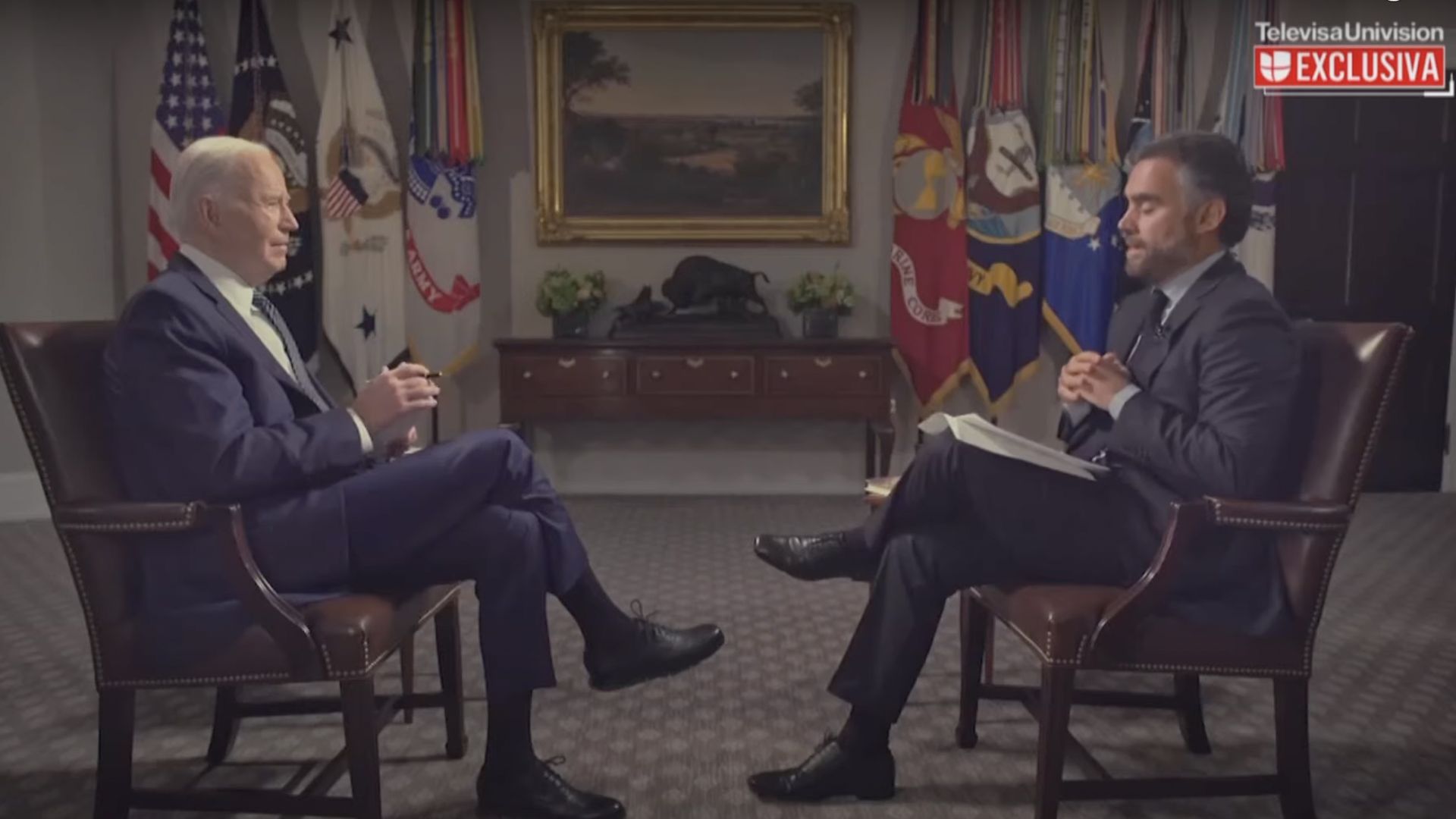 Biden is interviewed by an anchor in the Roosevelt room