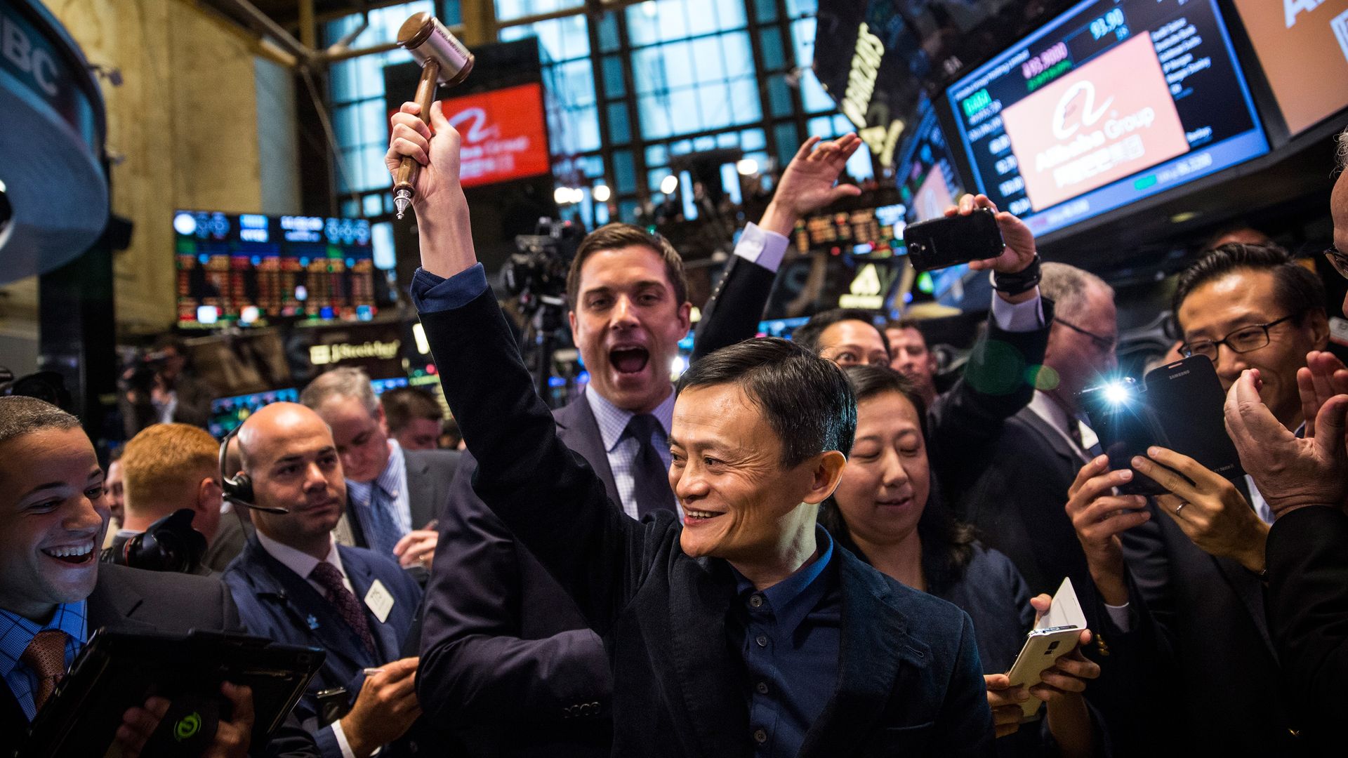 Jack Ma surrounded by people cheering