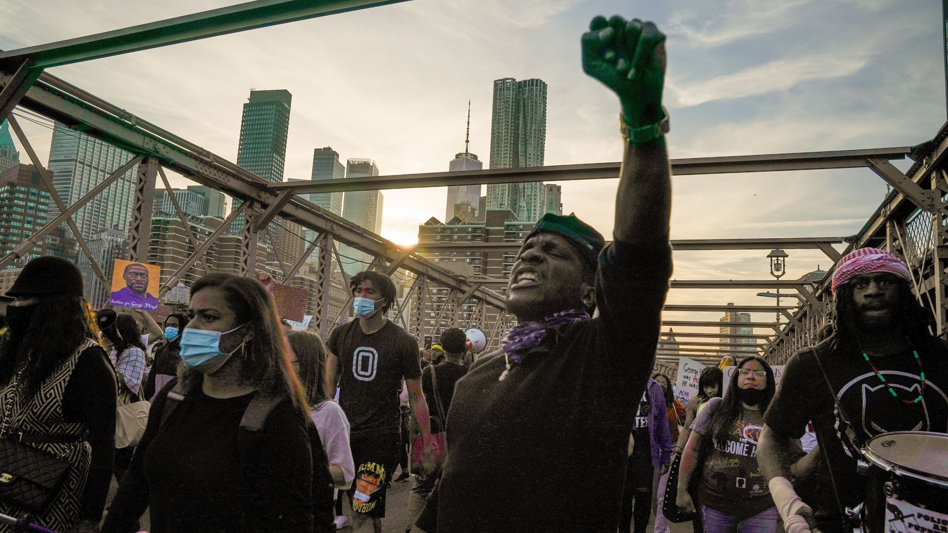 People cross the Brooklyn Bridge demanding police reform after a commemoration to honor the anniversary of George Floyd's death on May 25, 2021, in New York City. 