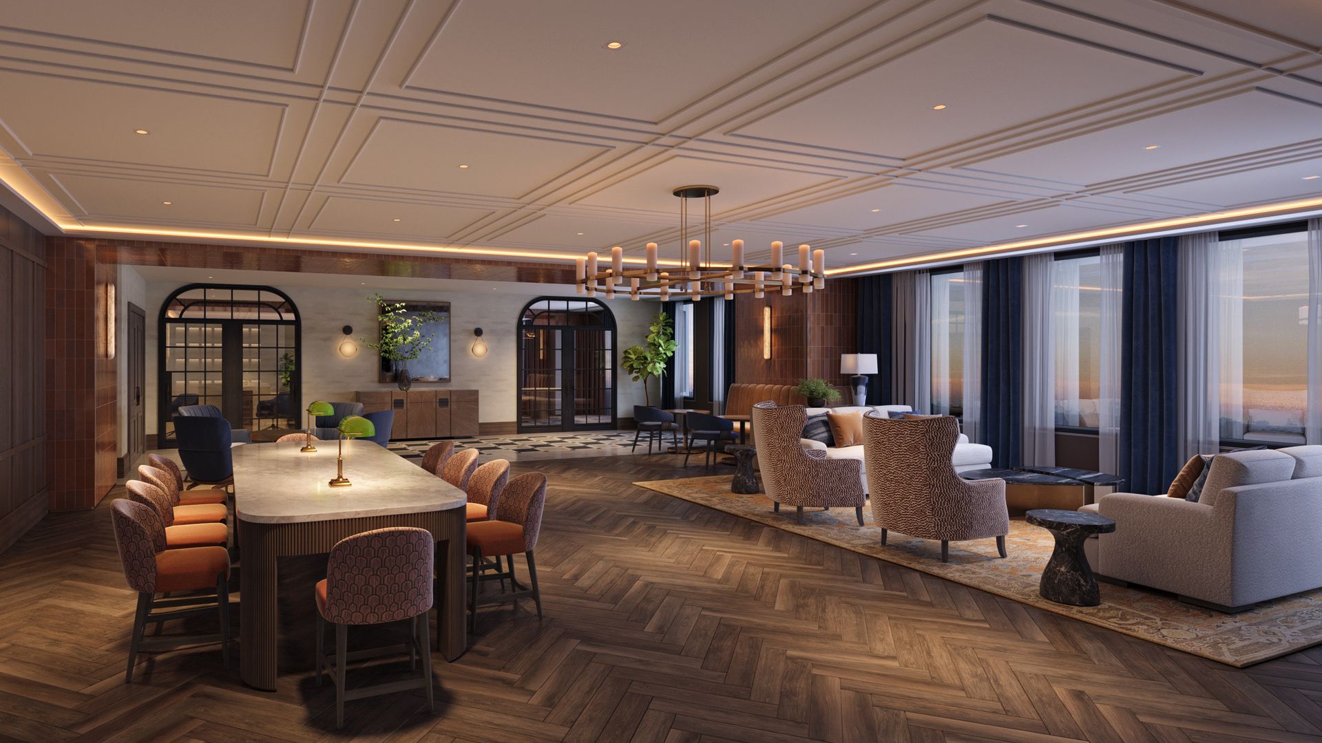 Luxurious open-plan lounge with a long marble dining table, orange chairs, warm wood floors, and a central chandelier; seating area with blue curtains and arched glass doors.