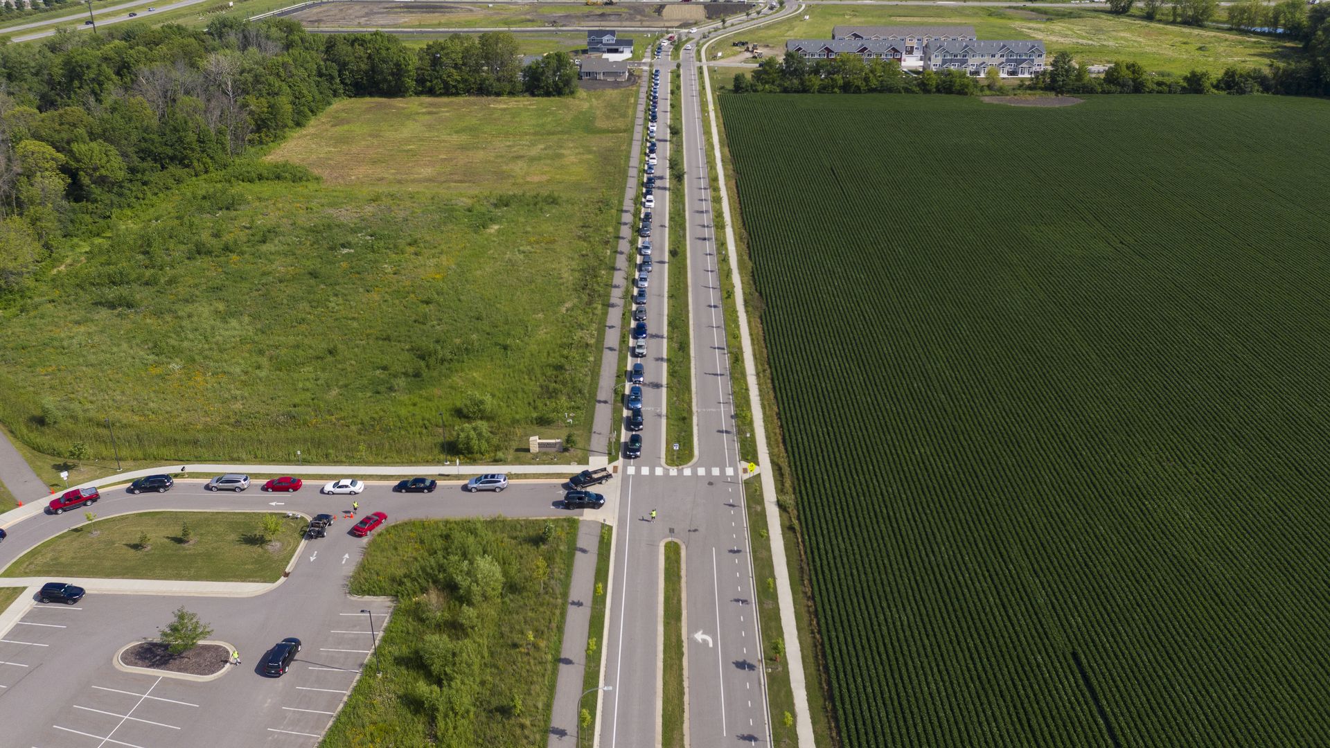 Drivers lined up for a pop-up grocery event in Mankato, Minnesota, in July 2020.