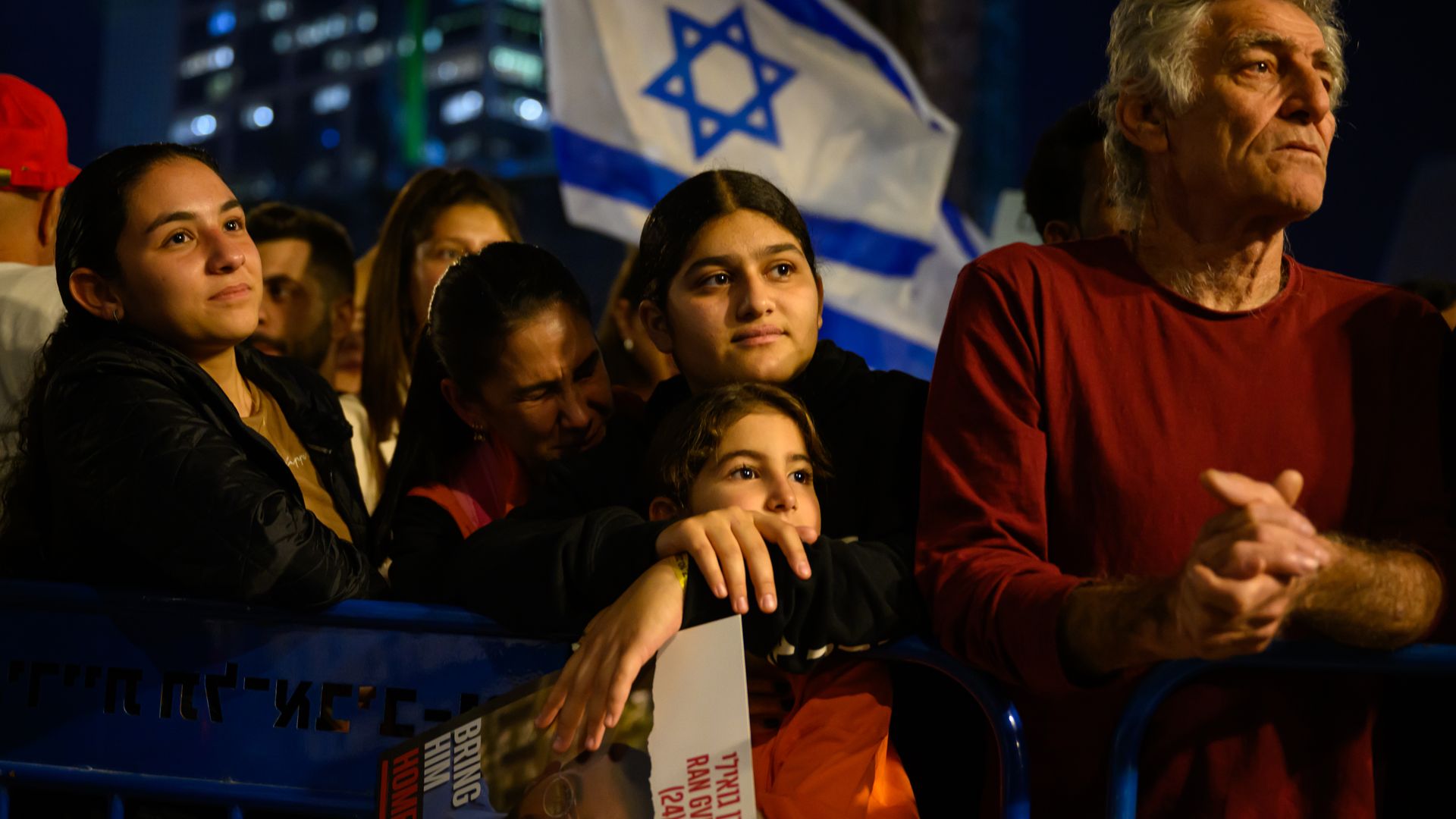 Demonstrators with an Israeli flag