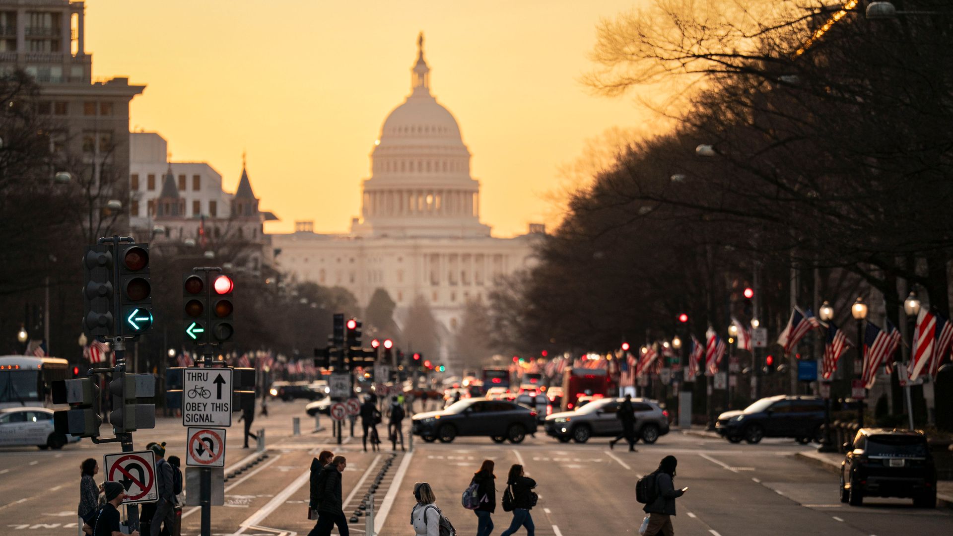Commuters cross Pennsylvania Avenue in Washington.