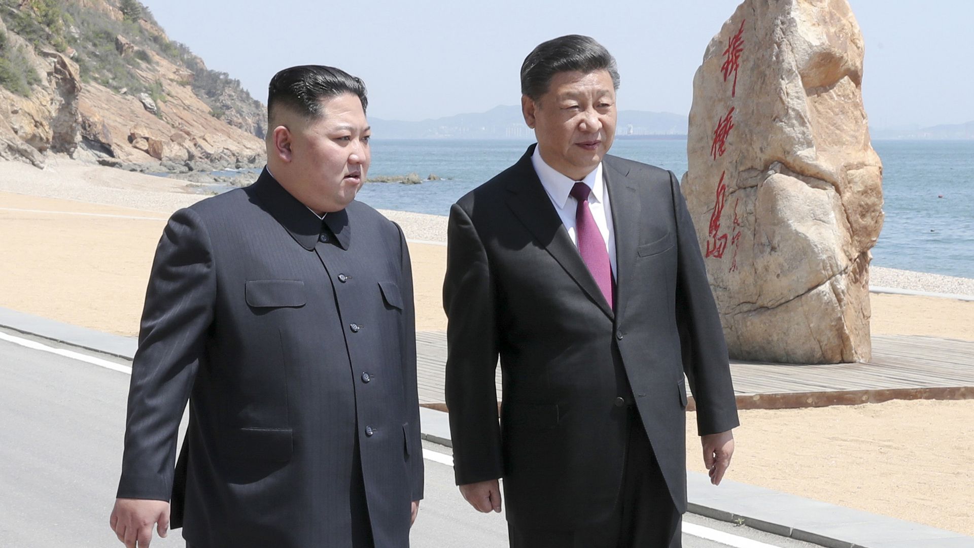 Kim Jong-un and Xi Jingping stroll in China