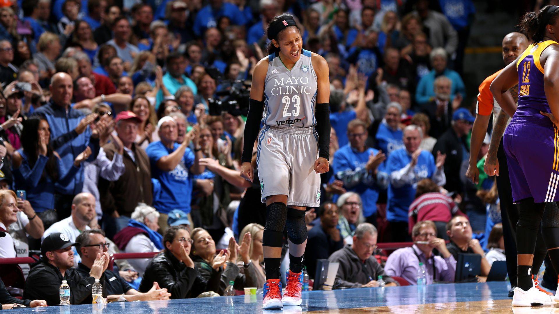 A photo of Maya Moore celebrating on the court 