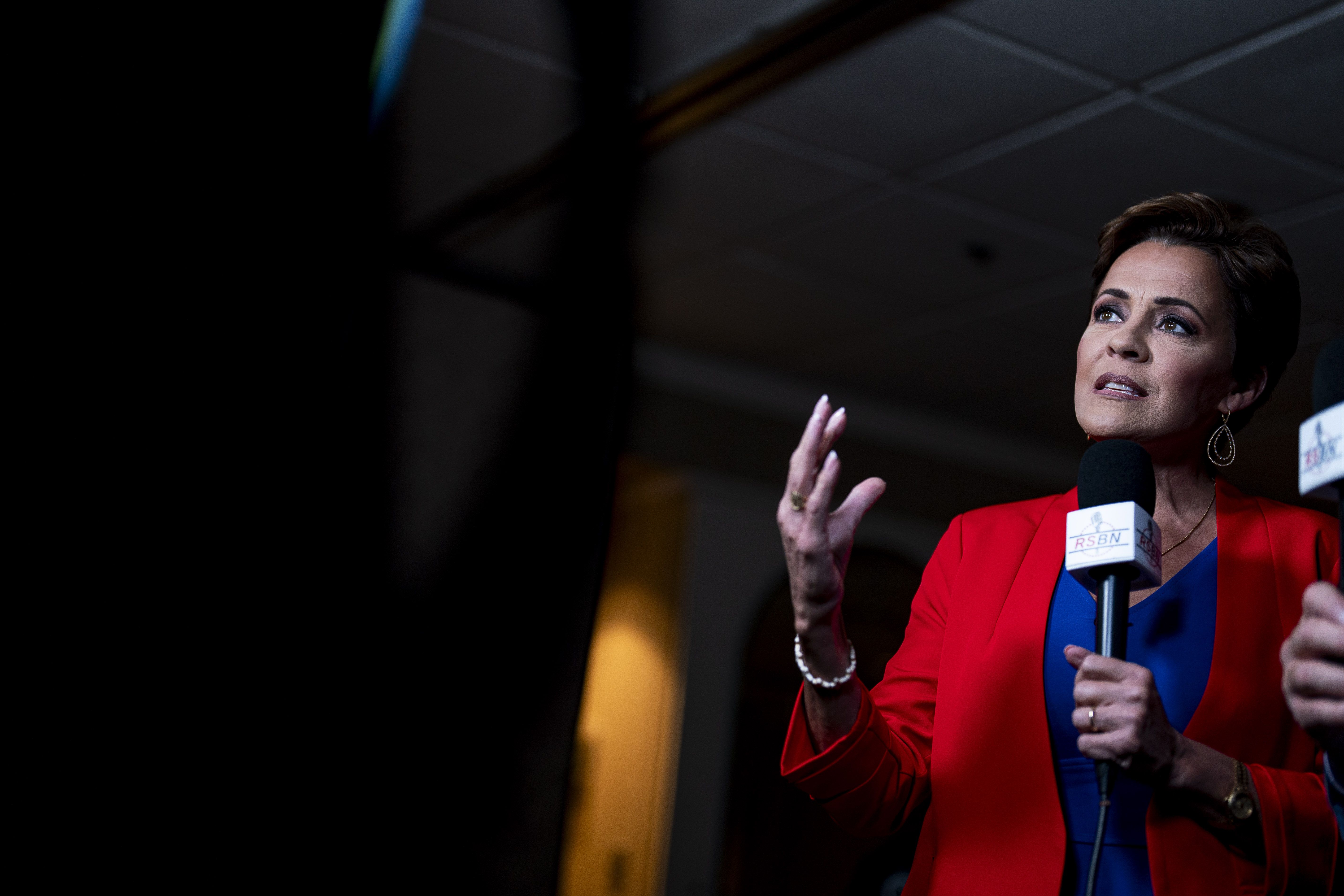 Kari Lake speaks during an interview at former President Trump's primary-night party in Laconia, N.H.