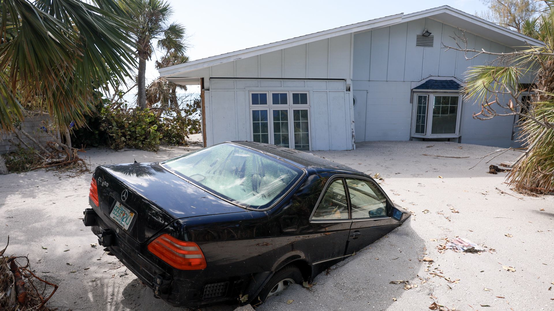 Vehicle stuck in beach sand after Hurricane Milton