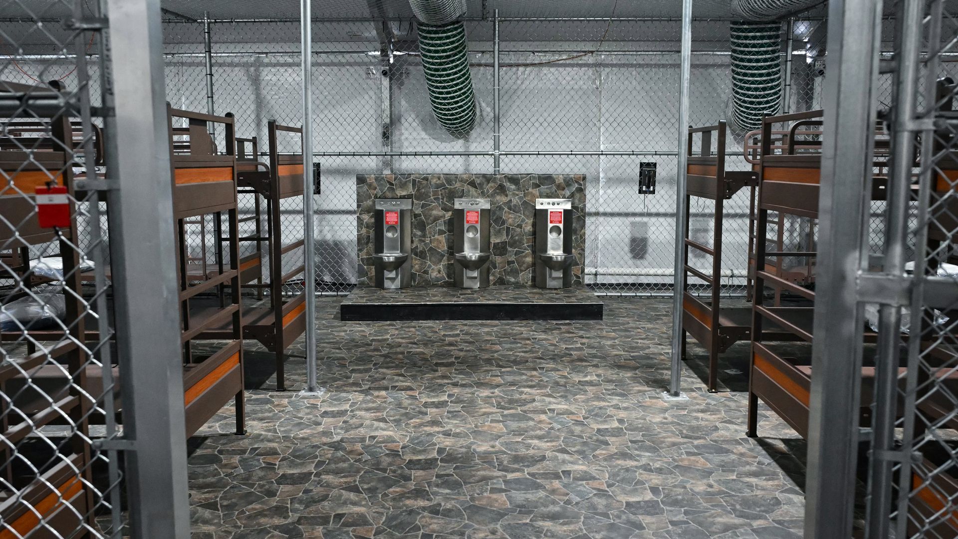  Toilets and beds are seen inside the Alligator Alcatraz migrant detention center. 