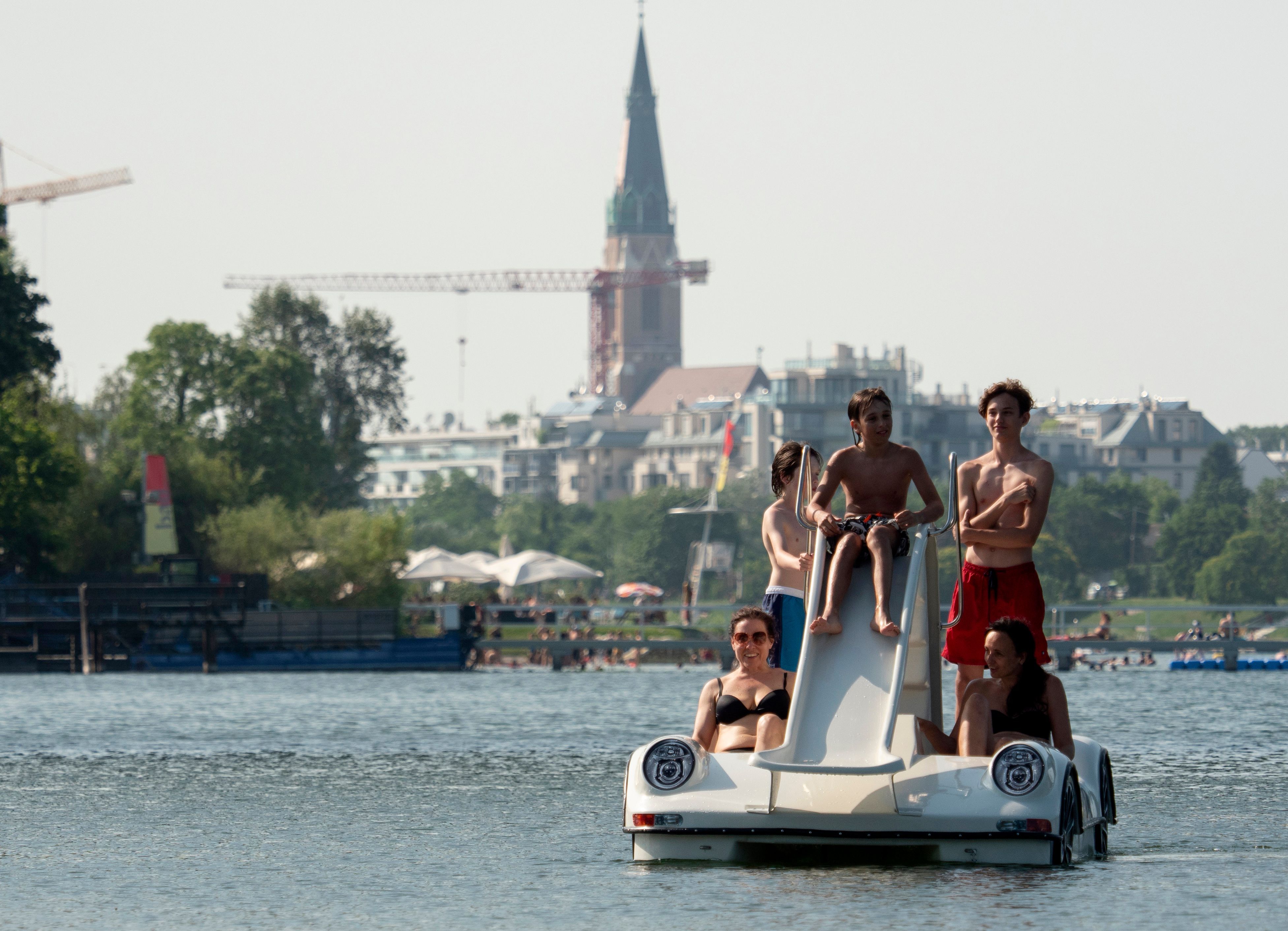 People make their way in peddal boats on the Old Danube (Alte Donnau), a subsidiary of the Danube river, in Vienna, Austria on June 25.