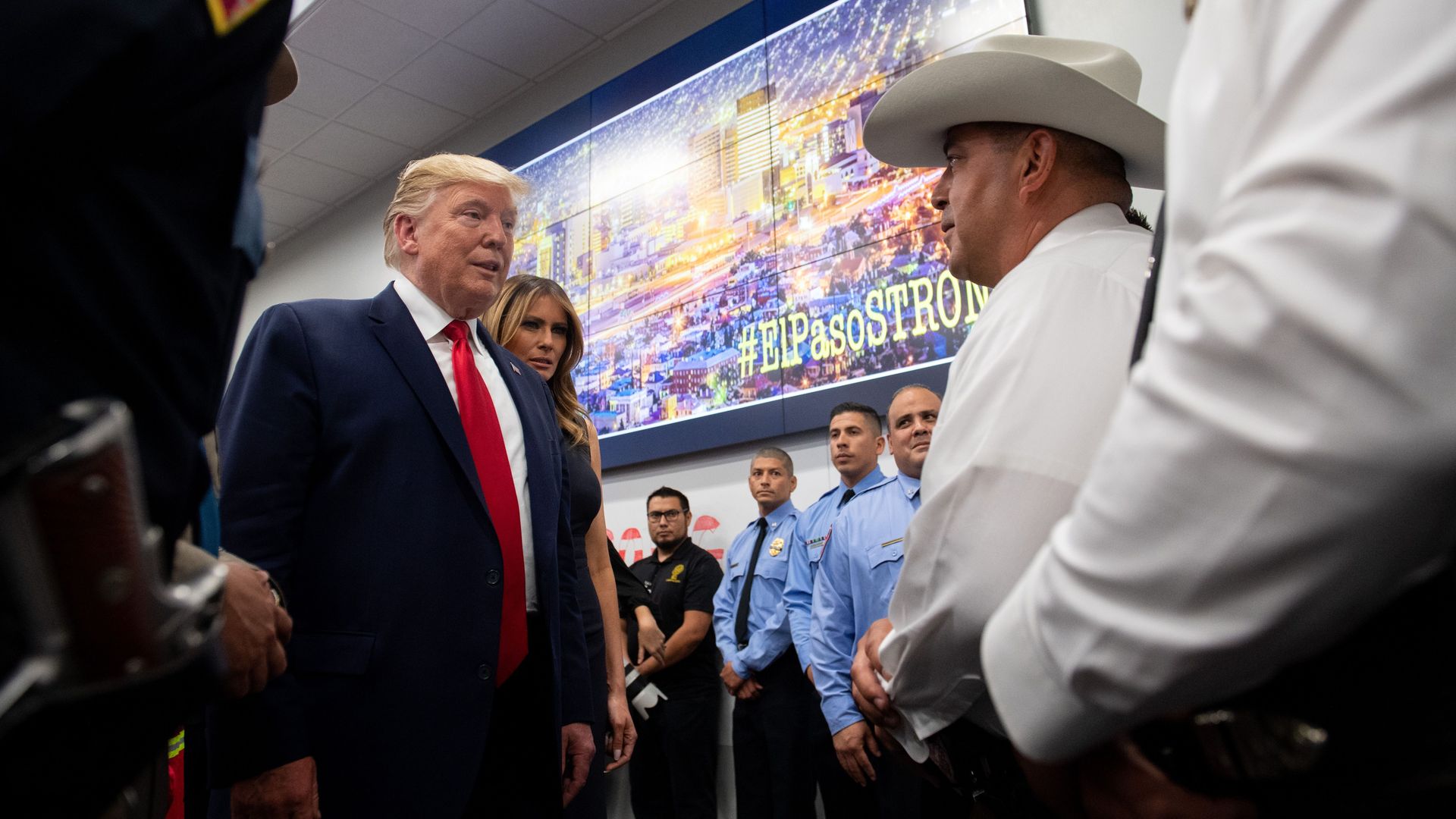 In this image, Trump speaks to law enforcement in El Paso, with Melania beside him