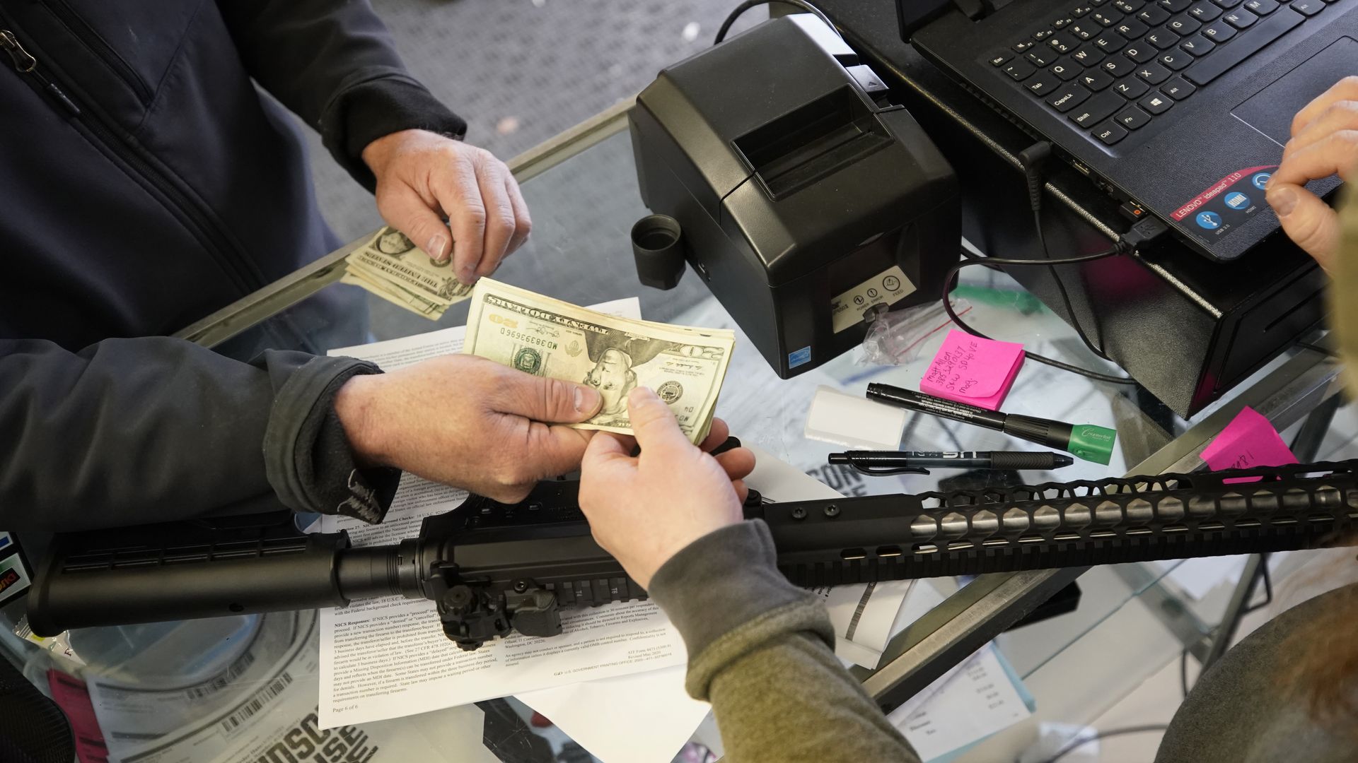 A customer purchasing an AR-15 in Orem, Utah, in March 2021.