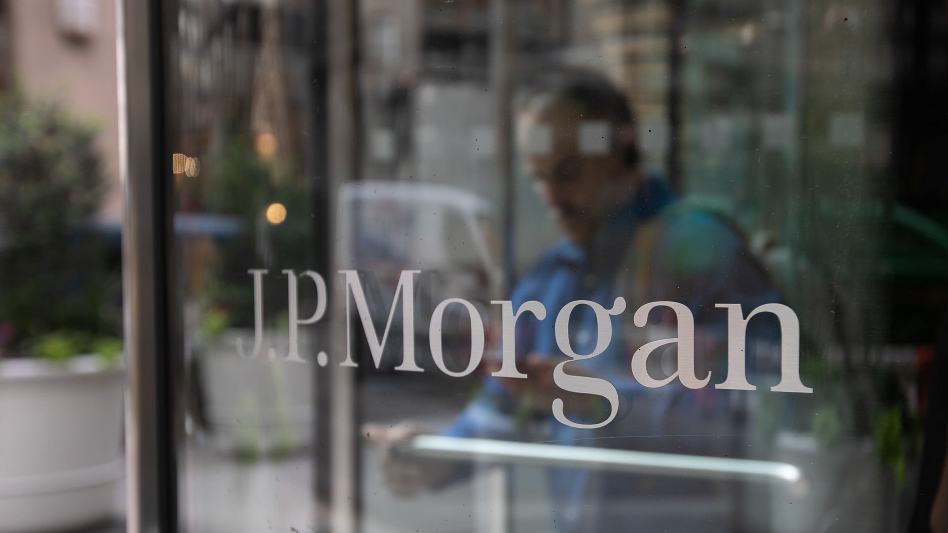 A glass door with the JPMorgan logo on it.