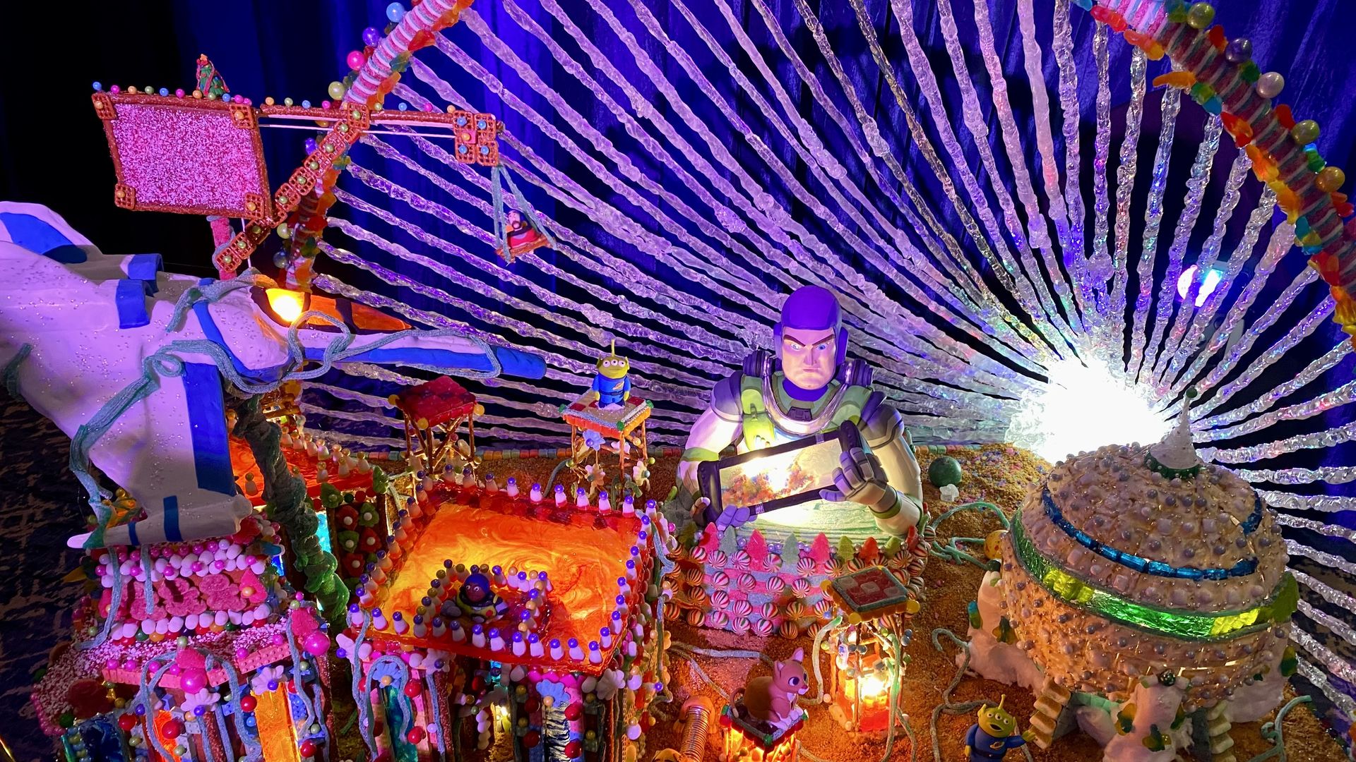 Space-themed display made of gingerbread, frosting and colorful sweets